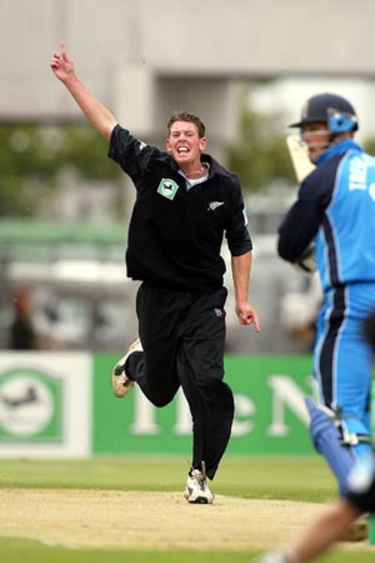 Debutant New Zealand bowler Ian Butler celebrates the dismissal of England batsman Marcus Trescothick, lbw for one. The wicket was taken on Butler's fifth ball in One-Day Internationals. Butler took 1-37 from five overs. 1st ODI: New Zealand v England at Jade Stadium, Christchurch, 13 February 2002.