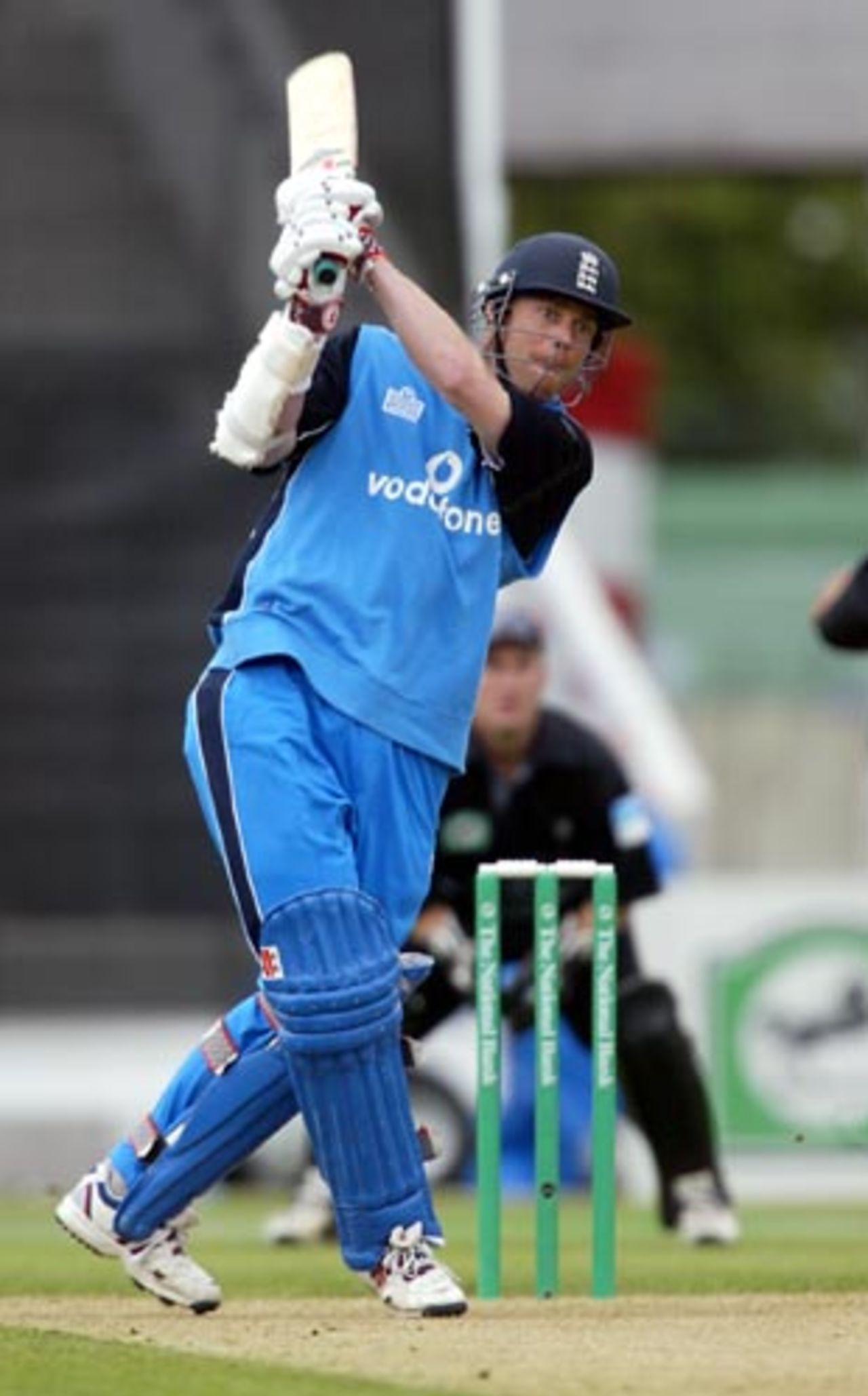 England batsman Nick Knight drives down the ground on the off side during his innings of 73. New Zealand wicket-keeper Chris Nevin looks on in the background. 1st ODI: New Zealand v England at Jade Stadium, Christchurch, 13 February 2002.