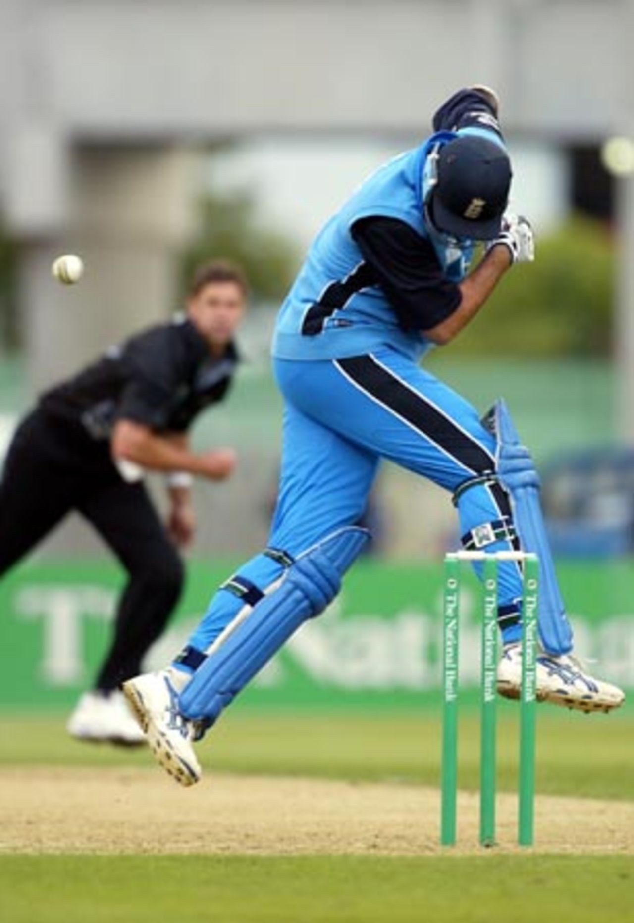 England batsman Andy Caddick is struck by a bouncer from New Zealand bowler Chris Cairns as he jumps to try and avoid it during his innings of two. 1st ODI: New Zealand v England at Jade Stadium, Christchurch, 13 February 2002.