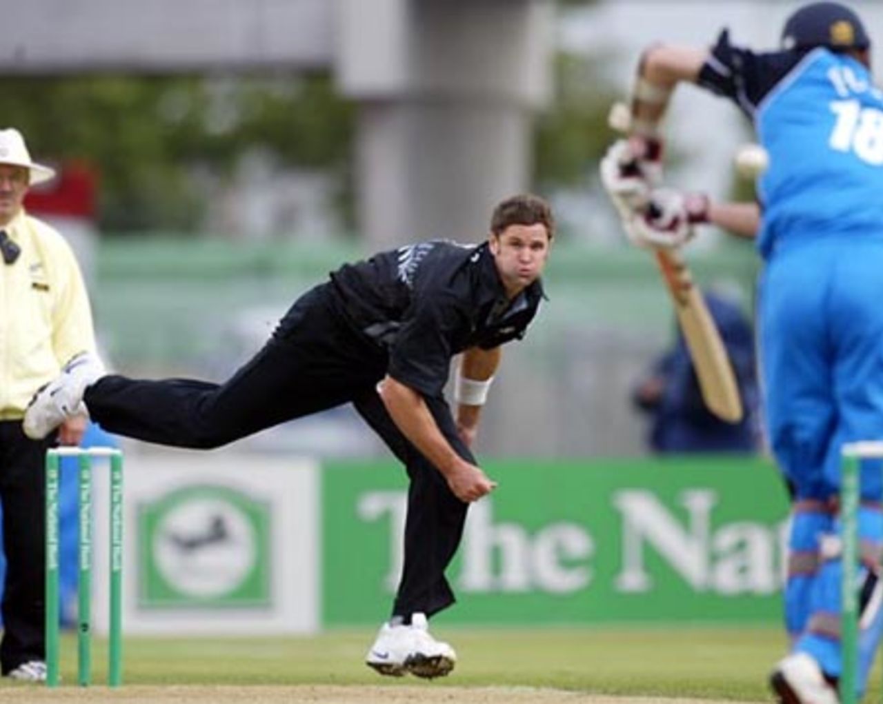 New Zealand bowler Chris Cairns delivers a short ball to England batsman James Foster down the leg side during his spell of 2-43 from nine overs. Umpire Evan Watkin looks on. 1st ODI: New Zealand v England at Jade Stadium, Christchurch, 13 February 2002.
