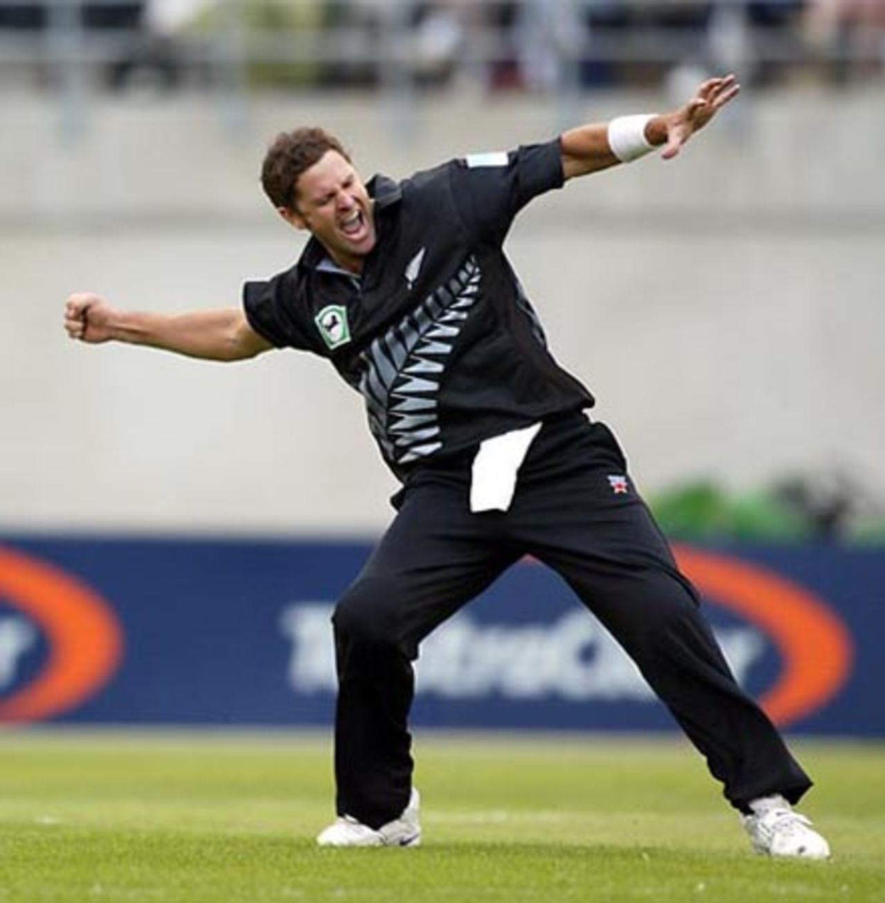 New Zealand bowler Chris Cairns celebrates the dismissal of England batsman Ashley Giles, caught by Chris Harris for two. 1st ODI: New Zealand v England at Jade Stadium, Christchurch, 13 February 2002.