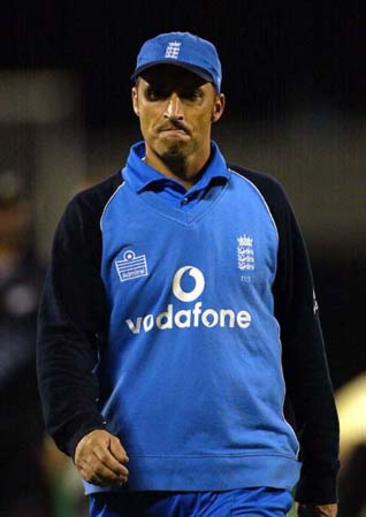 Disappointed England captain Nasser Hussain walks from the field after England lose by four wickets. 1st ODI: New Zealand v England at Jade Stadium, Christchurch, 13 February 2002.