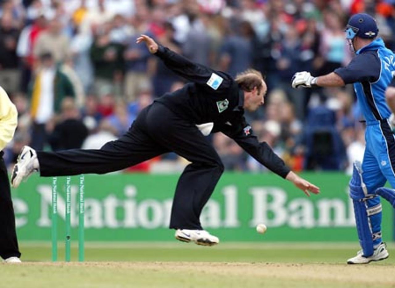 New Zealand bowler Chris Harris unsuccessfully tries to field off his own bowling during his spell of 1-29 from seven overs. England batsman Graham Thorpe looks on. 3rd ODI: New Zealand v England at McLean Park, Napier, 20 February 2002.