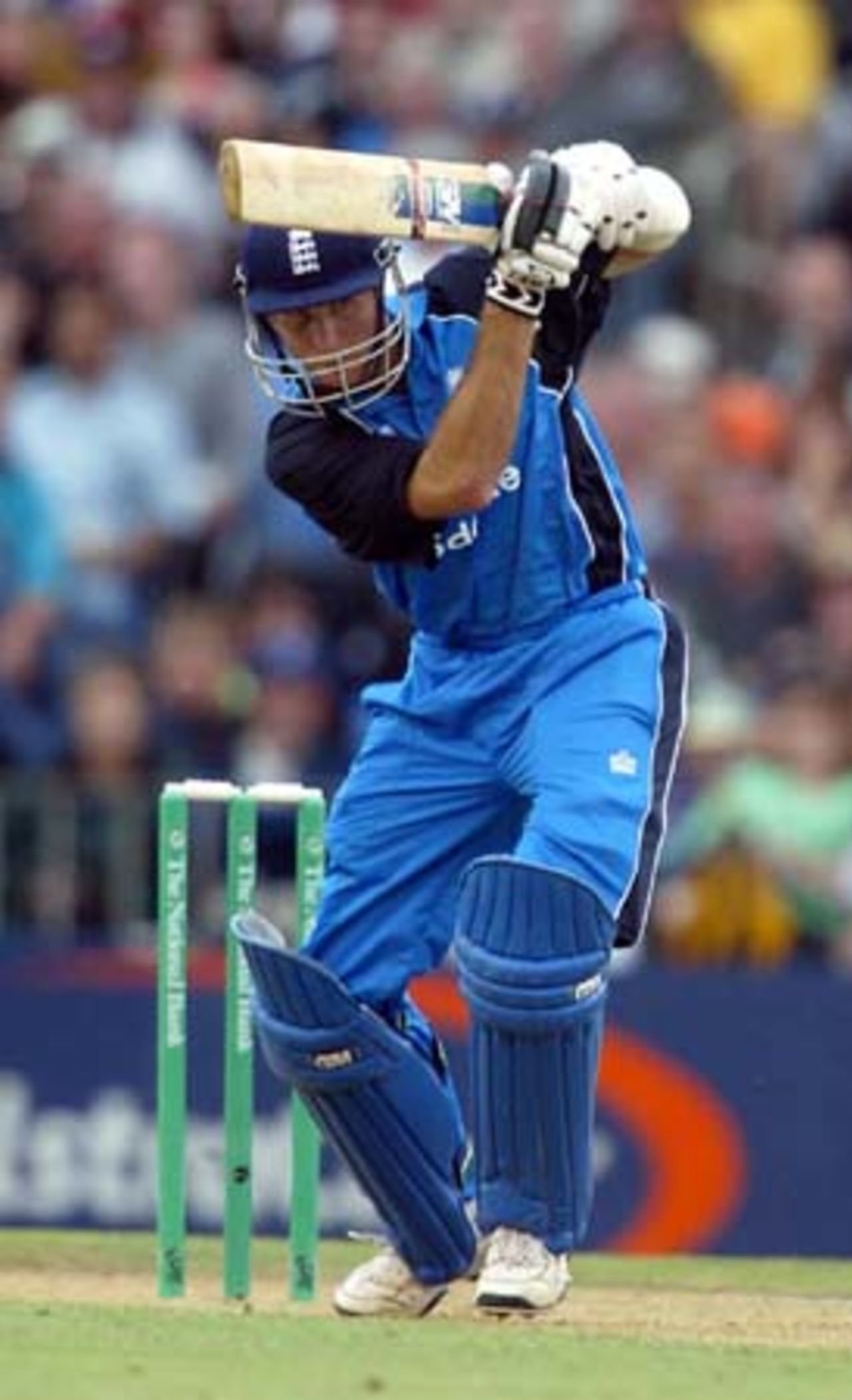 England batsman Michael Vaughan drives a delivery from New Zealand bowler Chris Cairns during his innings of 59. 4th ODI: New Zealand v England at Eden Park, Auckland, 23 February 2002.