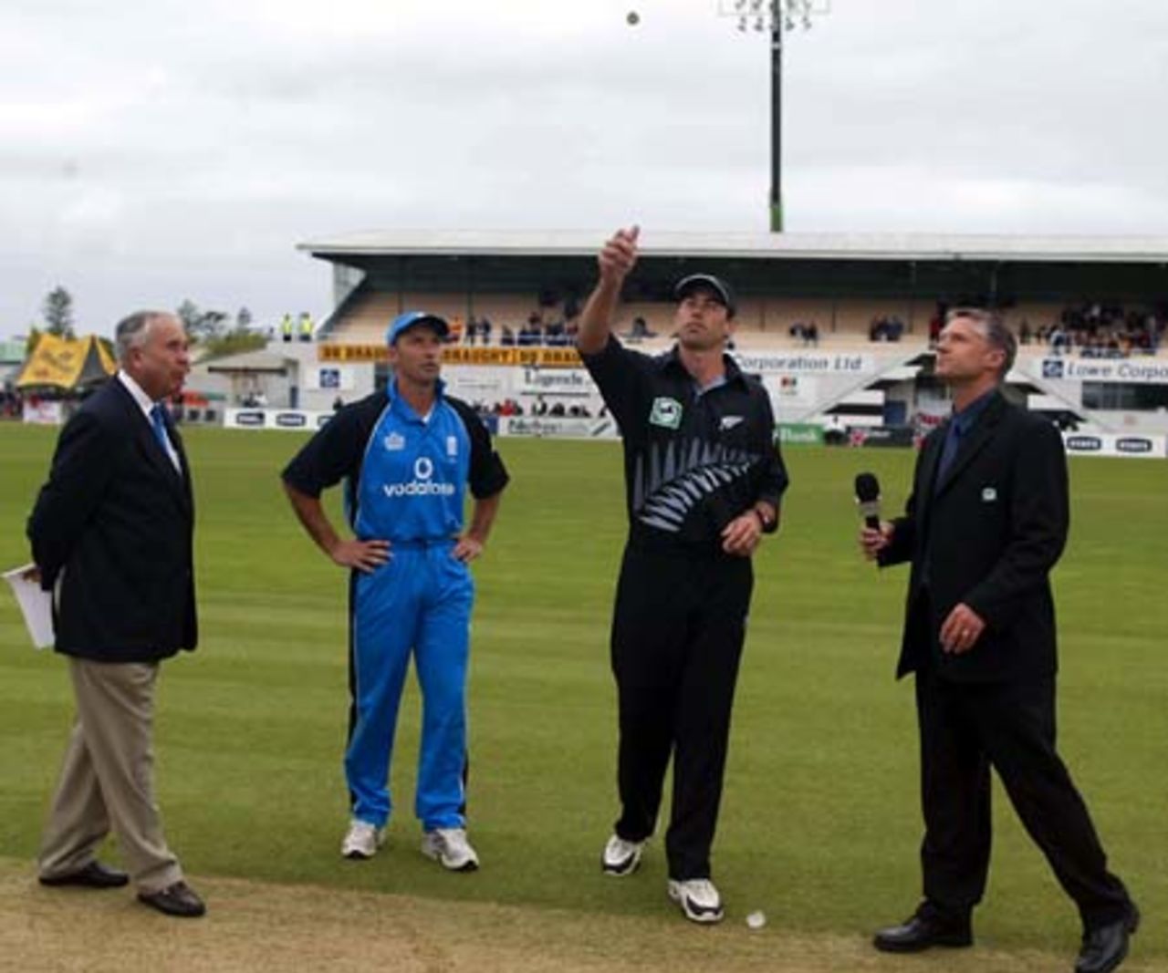 New Zealand captain Stephen Fleming tosses the coin as match referee Jackie Hendriks, England captain Nasser Hussain and National Bank sponsorship manager Gavin Larsen look on. Fleming won the toss and chose to bowl first. 3rd ODI: New Zealand v England at McLean Park, Napier, 20 February 2002.