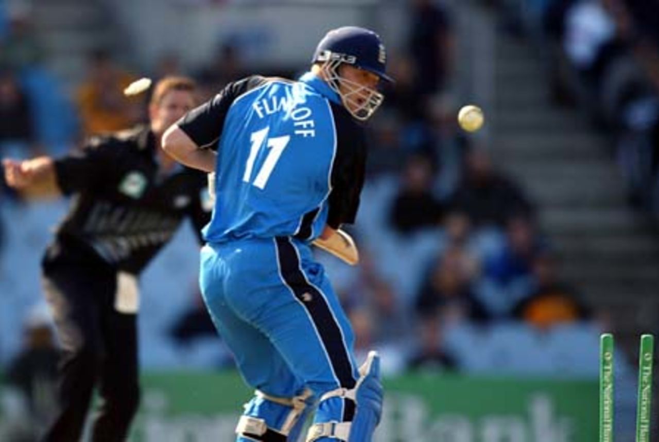England batsman Andrew Flintoff looks back to see he is bowled by New Zealand bowler Chris Cairns for one. 5th ODI: New Zealand v England at Carisbrook, Dunedin, 26 February 2002.