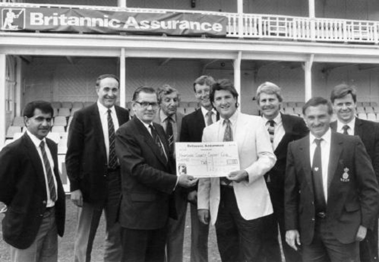 Hamphire captain Mark Nicholas receives a cheque for £2,000 for reaching 5th place in the BAC.<br>From left to right: Raj Maru, Tony Baker, Eric Hood (BA), D.Rich (Chairman HCCC), Tim Tremlett, <BR>Mark Nicholas, Chris Smith, David Turner and David Carter (BA).