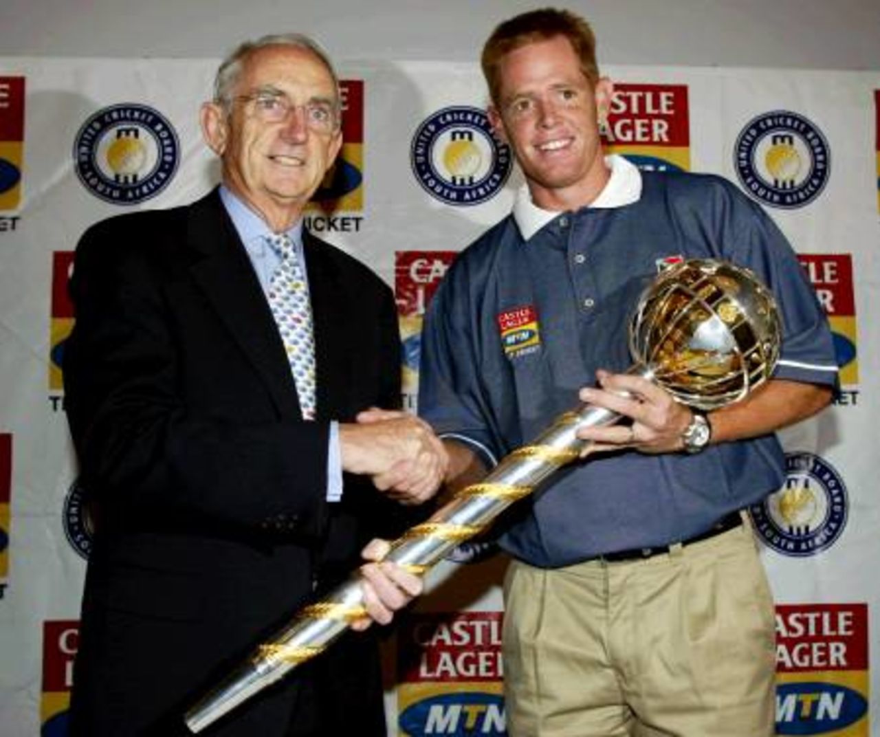 South African cricket captain Shaun Pollock shakes hands with the International Cricket Council (ICC) President Malcolm Gray