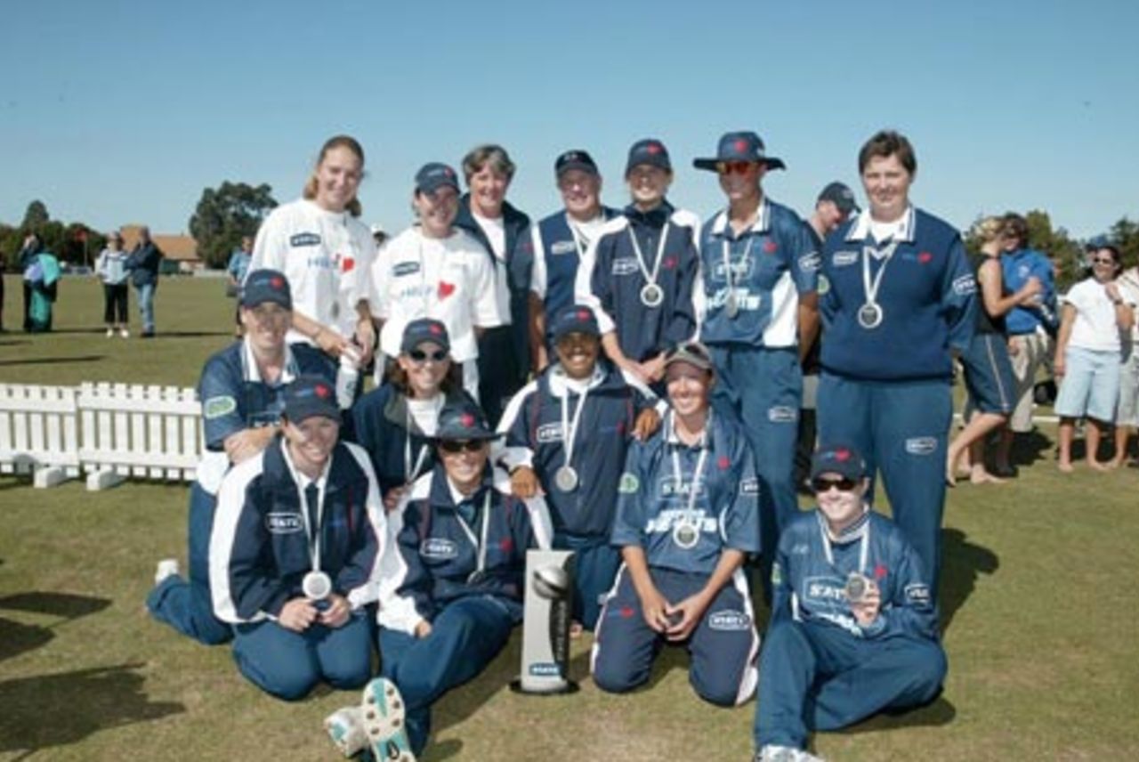 Members of the Auckland women's team with the State League trophy. State League Final: Canterbury Women v Auckland Women at Redwood Park, Christchurch, 22 February 2003.