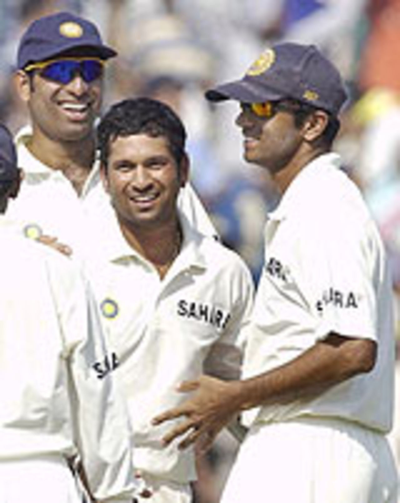 VVS Laxman, Sachin Tendulkar and Rahul Dravid gather to celebrate Stephen Fleming's dismissal, India v New Zealand, 2nd Test, Mohali, October 17, 2003