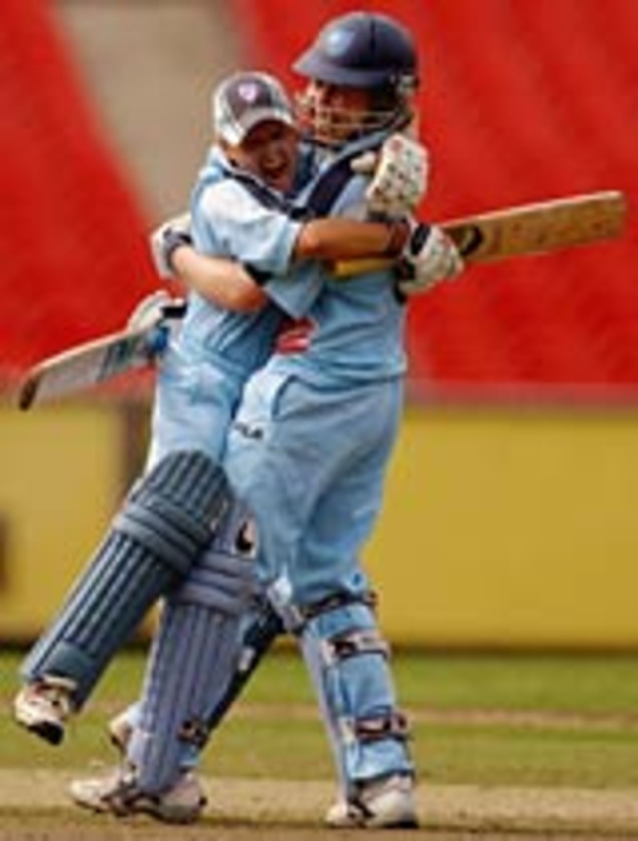 Leonie Coleman and Alex Blackwell of New South Wales celebrate hitting the winning runs to defeat Victoria in the Womens National Cricket League 3rd Final , Melbourne, February 2, 2004