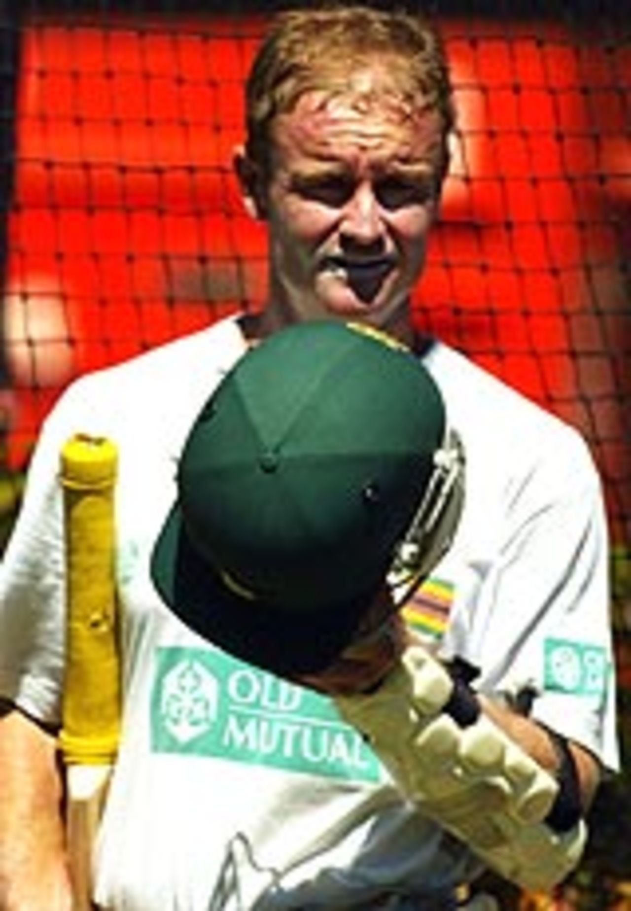 Grant Flower looks at his helmet in a practice session, VB Series, Perth, February 2nd, 2004