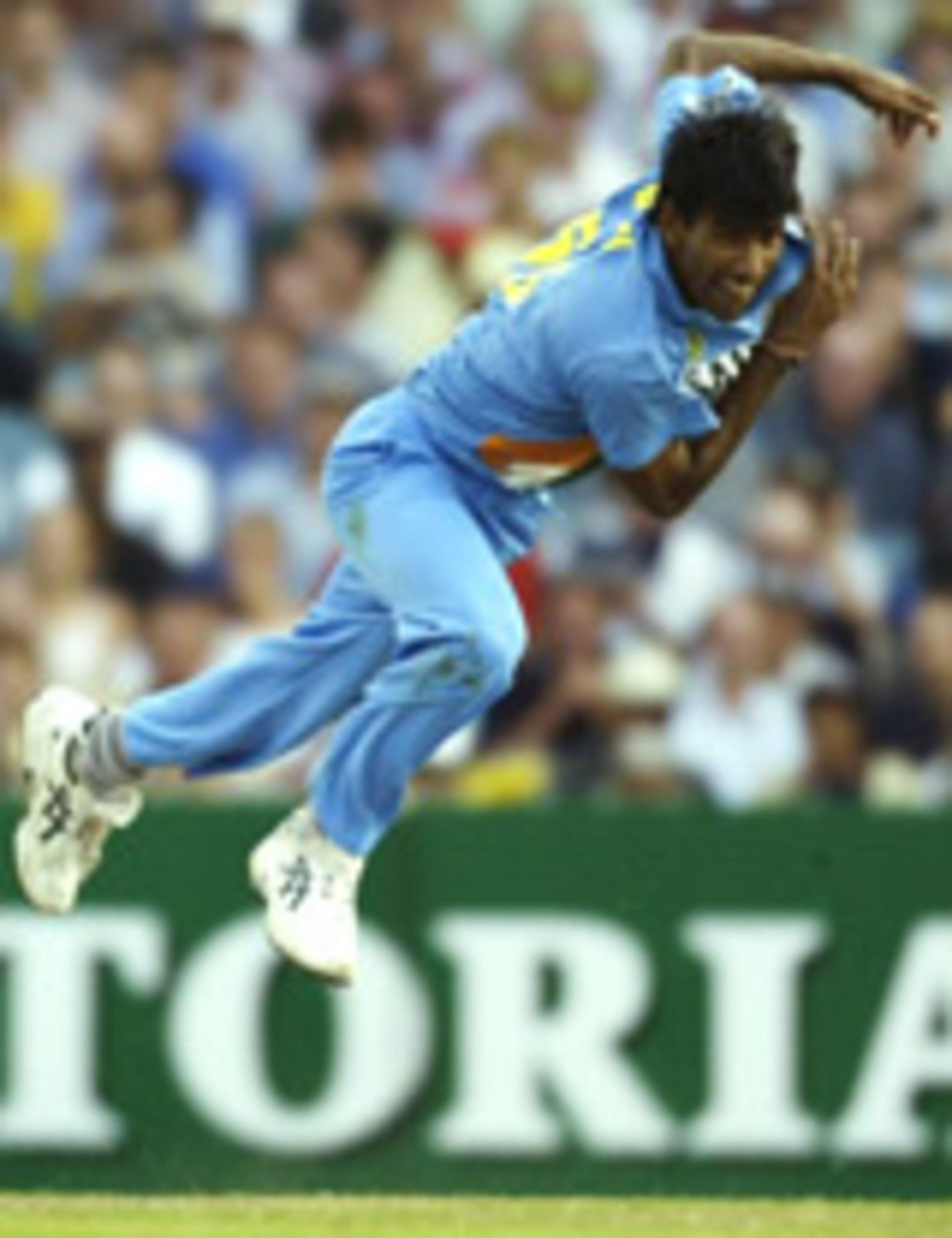 Lakshmipathy Balaji is airborne while bowling, Australia v India, VB Series, 1st final, Melbourne, February 6, 2004