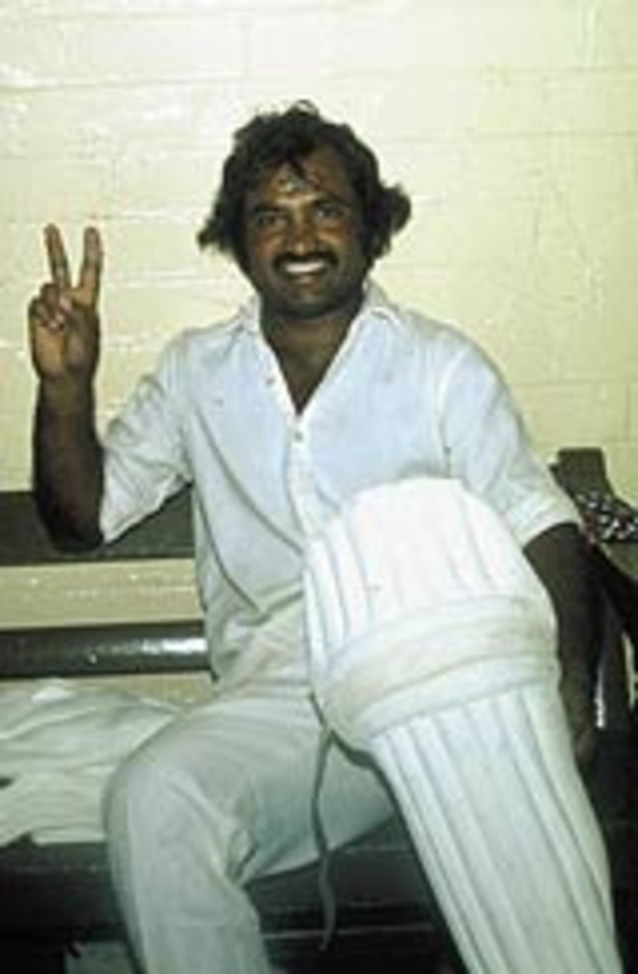 Mushtaq Mohammad gives the victory sign in the dressing room after a match, January 1, 1980