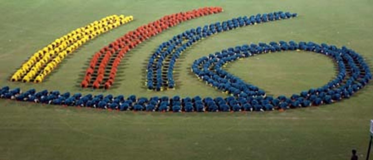 Bangladeshi schoolchildren form the logo of the Under-19 cricket world cup, during the opening ceremony at Bangabandhu National Stadium in Dhaka, 10 February 2004