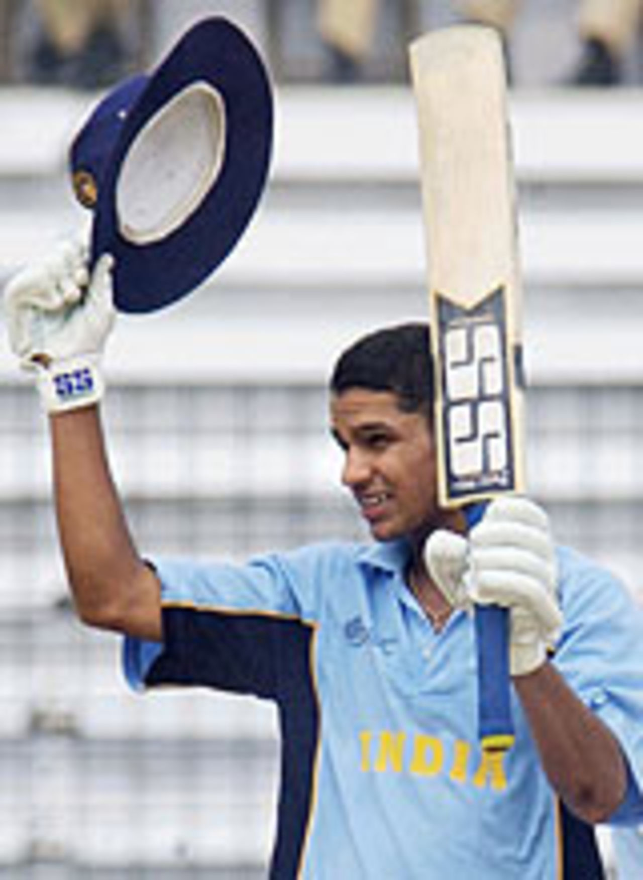 Shikhar Dhawan raises his bat after yet another century, Bangladesh Under 19 v India Under 19, Under-19 World Cup, February 20, 2004.