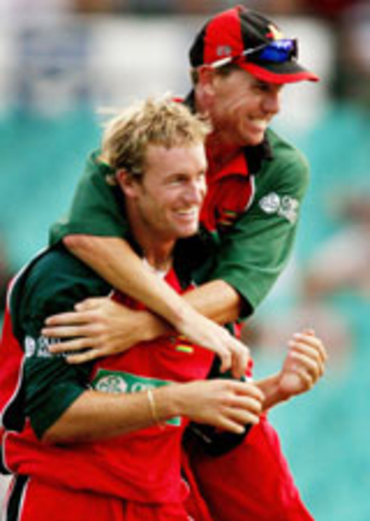 Sean Ervine celebrates with Ray Price after taking a wicket, Australia v Zimbabwe, Sydney, January 11, 2004