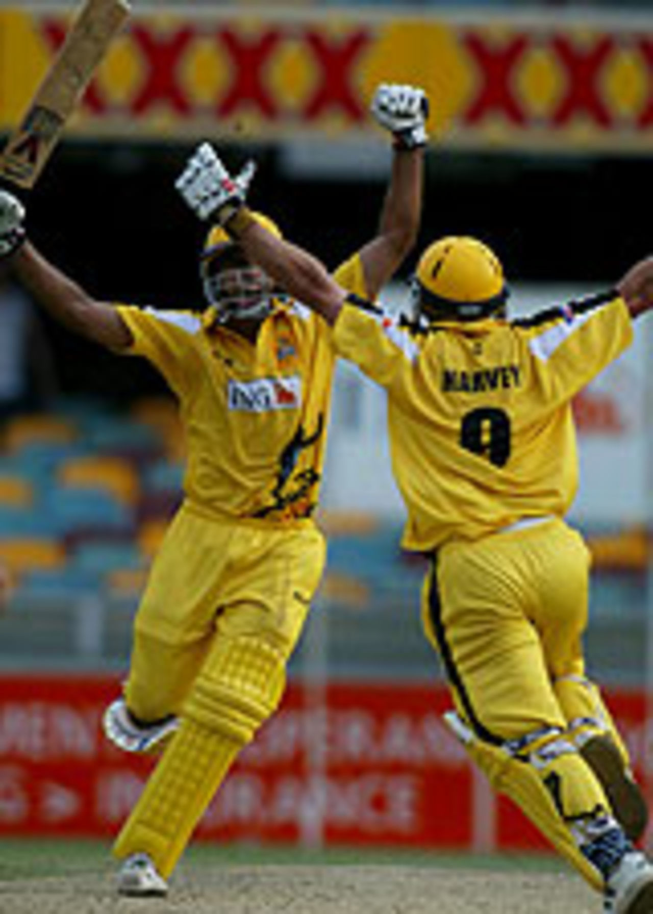 Kade Harvey and Darren Wakes celebrate victory in the ING Cup final, Western Australia v Queensland, February 29, 2004