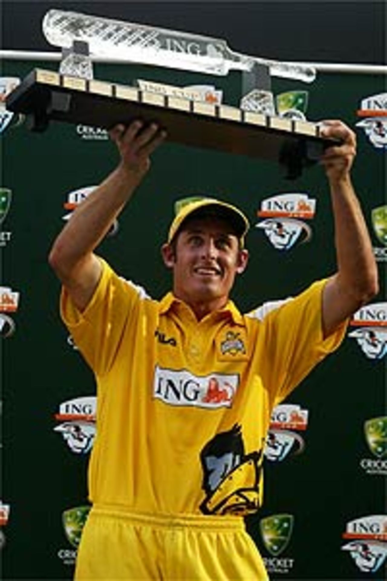 Mike Hussey of the Western Warriors holds the ING Cup aloft after the ING Cup final between the Queensland Bulls and Western Warriors played at the Gabba February 29, 2004 in Brisbane, Australia