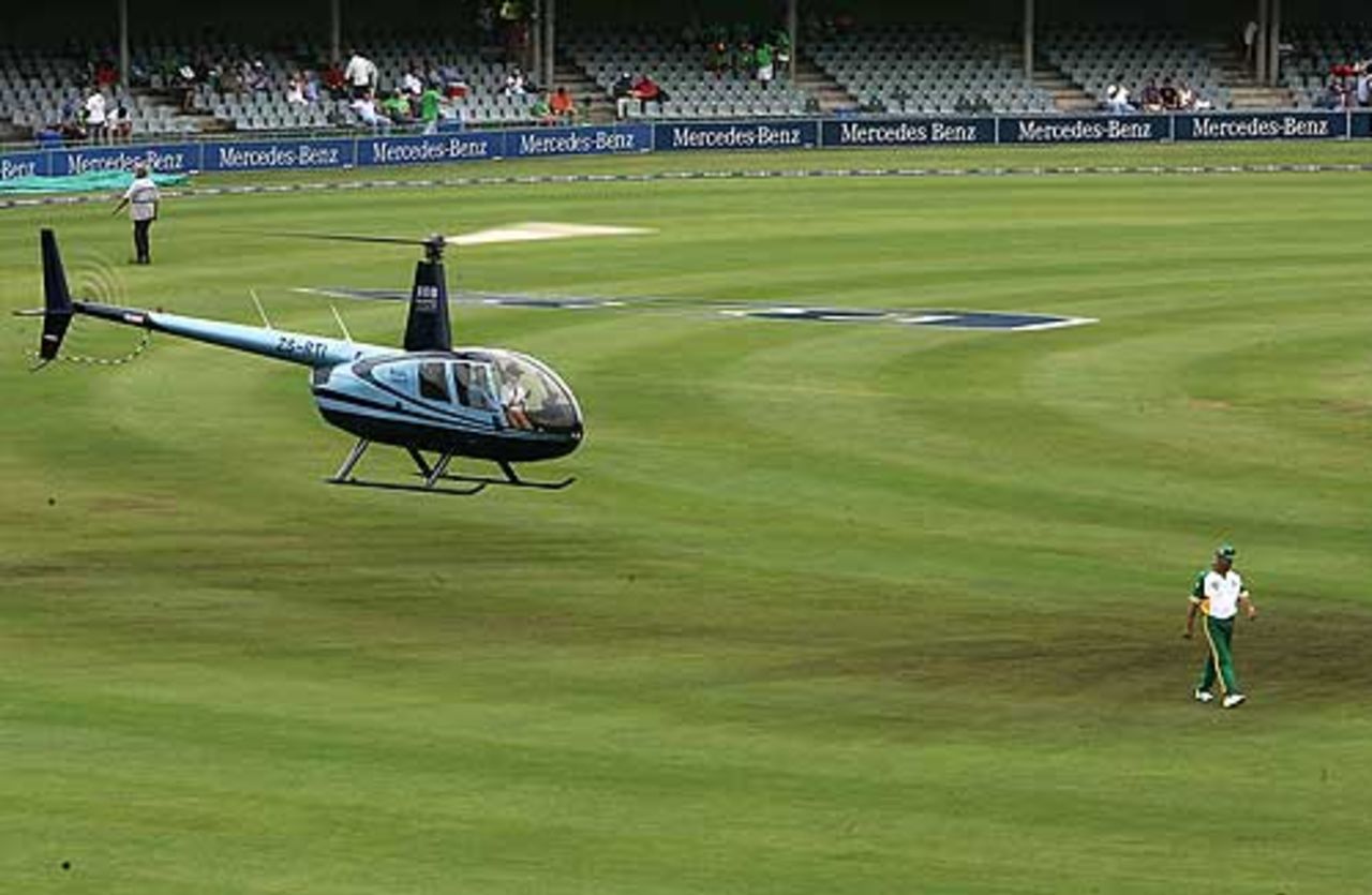 A helicopter helps to dry the outfield, ahead of the fifth one-day international at Buffalo Park, East London, February 8, 2005