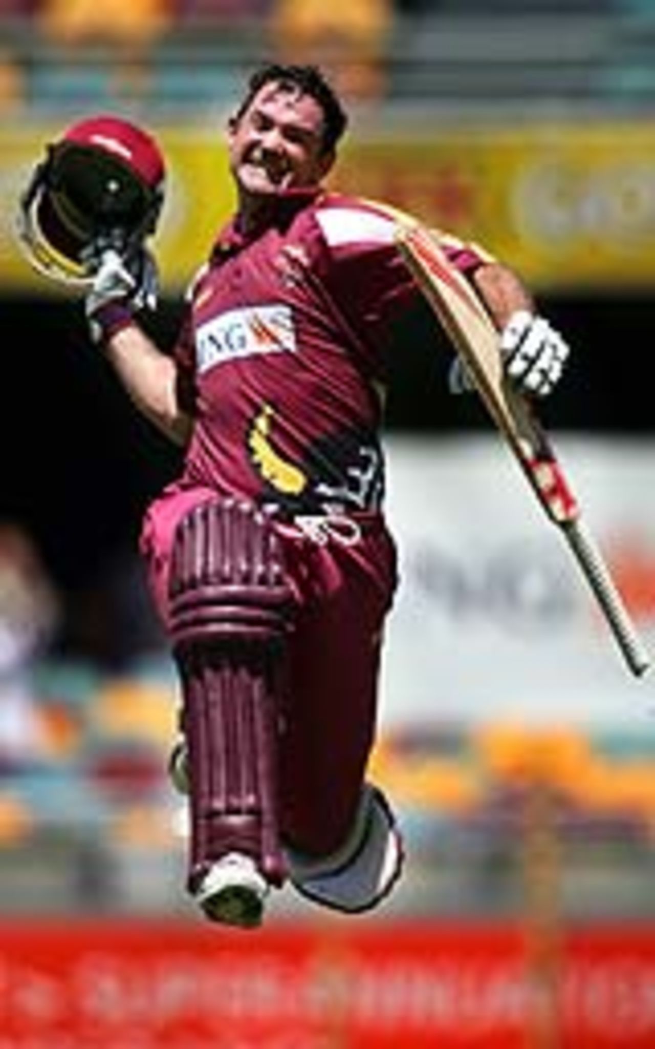Jimmy Maher leaps in the air after reaching his century, Queensland v Tasmania, ING Cup final, Brisbane, February 20, 2005