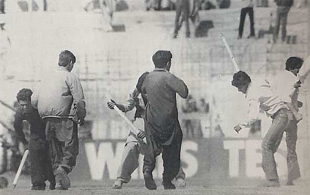 Spectators dig up the wicket during the Karachi Test, Pakistan v India, 1982-83