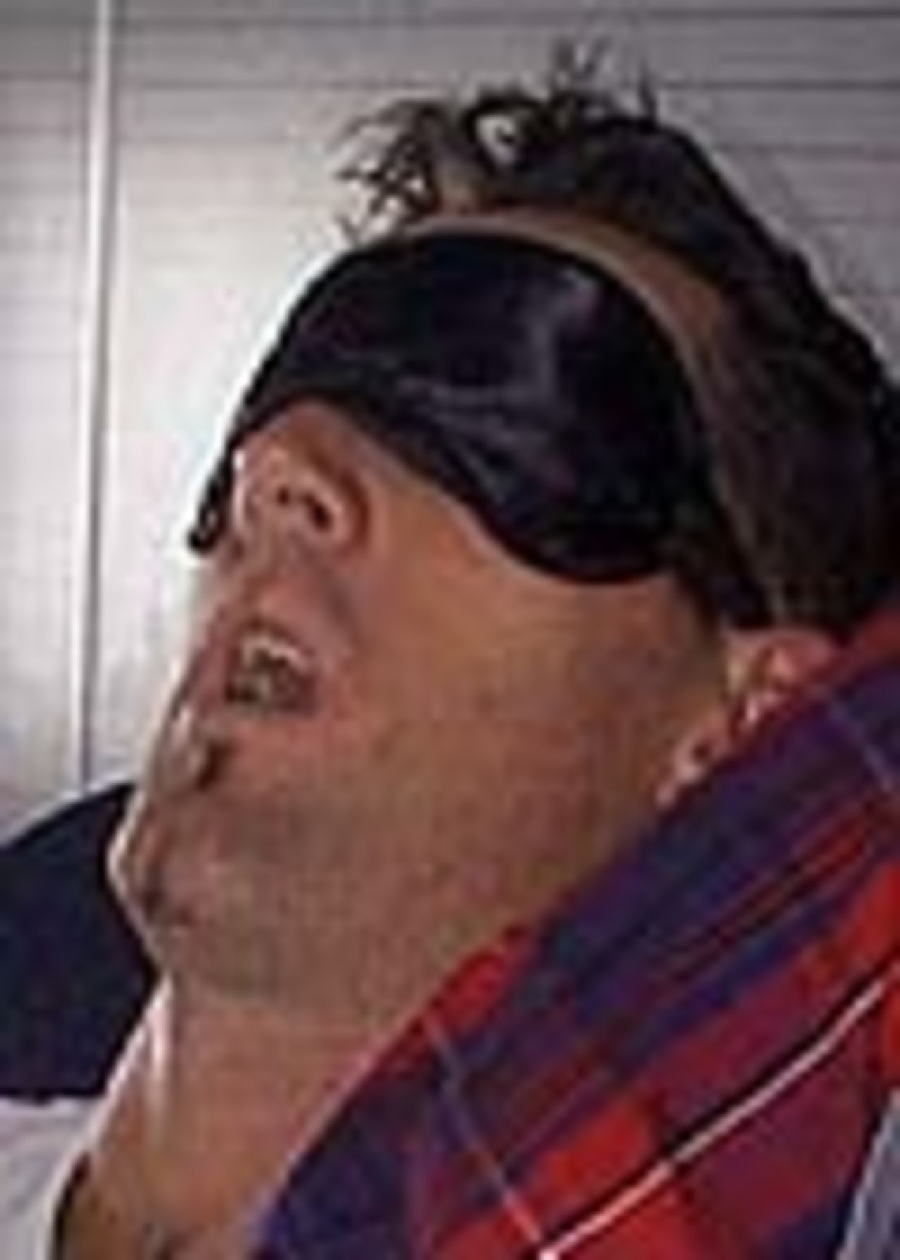 Matthew Elliott sleeps off the effects of sea sickness after a fishing trip in Trinidad, March 10, 1999.