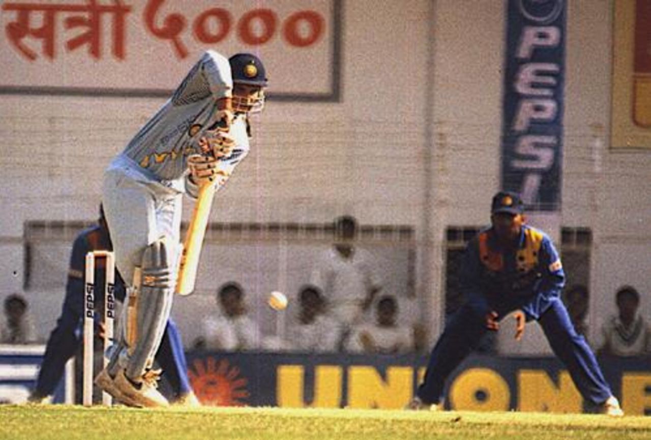 Saurav Ganguly pushes off the backfoot as wicket-keeper Tillakaratne and Aravinda deSilva look on