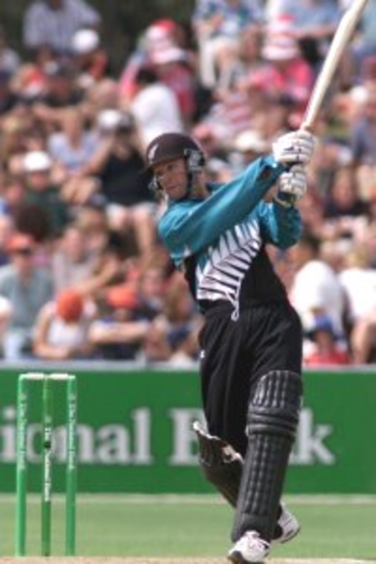 01 Mar 2000: Nathan Astle of New Zealand hits a four off the bowling of Damien Fleming of Australia, during the fifth one day international between New Zealand at McLean Park, Napier, New Zealand.
