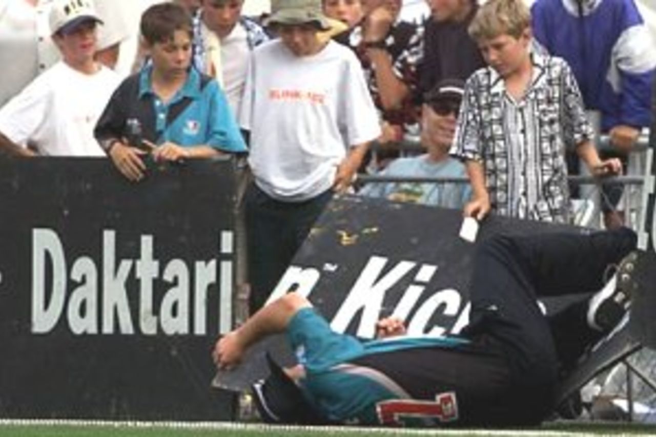 01 Mar 2000: Roger Twose of New Zealand collides with the fence while fielding, during the fifth one day international between New Zealand at McLean Park, Napier, New Zealand.