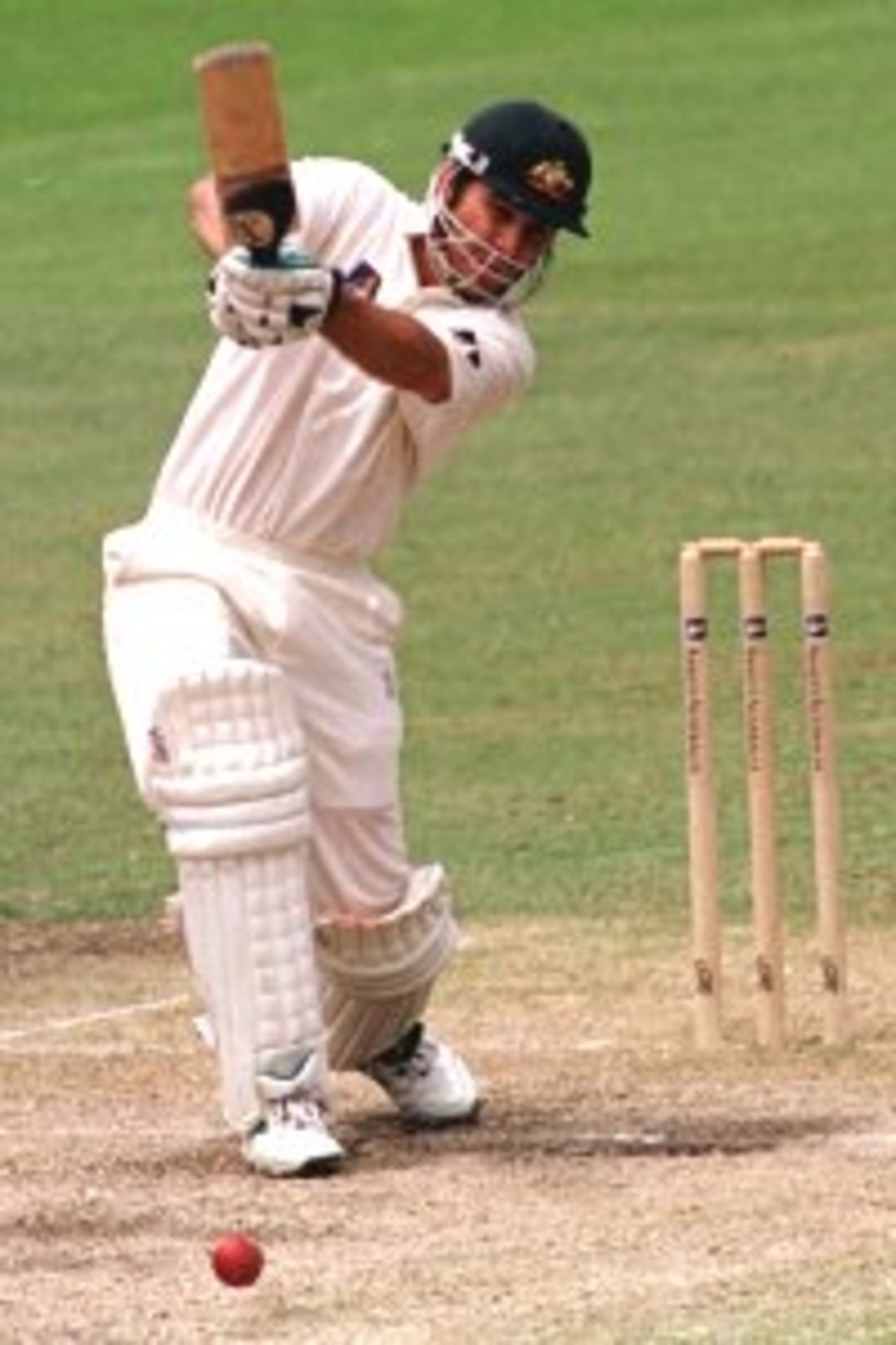 4 Jan 2000: Justin Langer of Australia drives through mid off during his innings of 223 against India during the third days play of the Third Test Match between Australia and India at the Sydney Cricket Ground, Sydney, Australia.