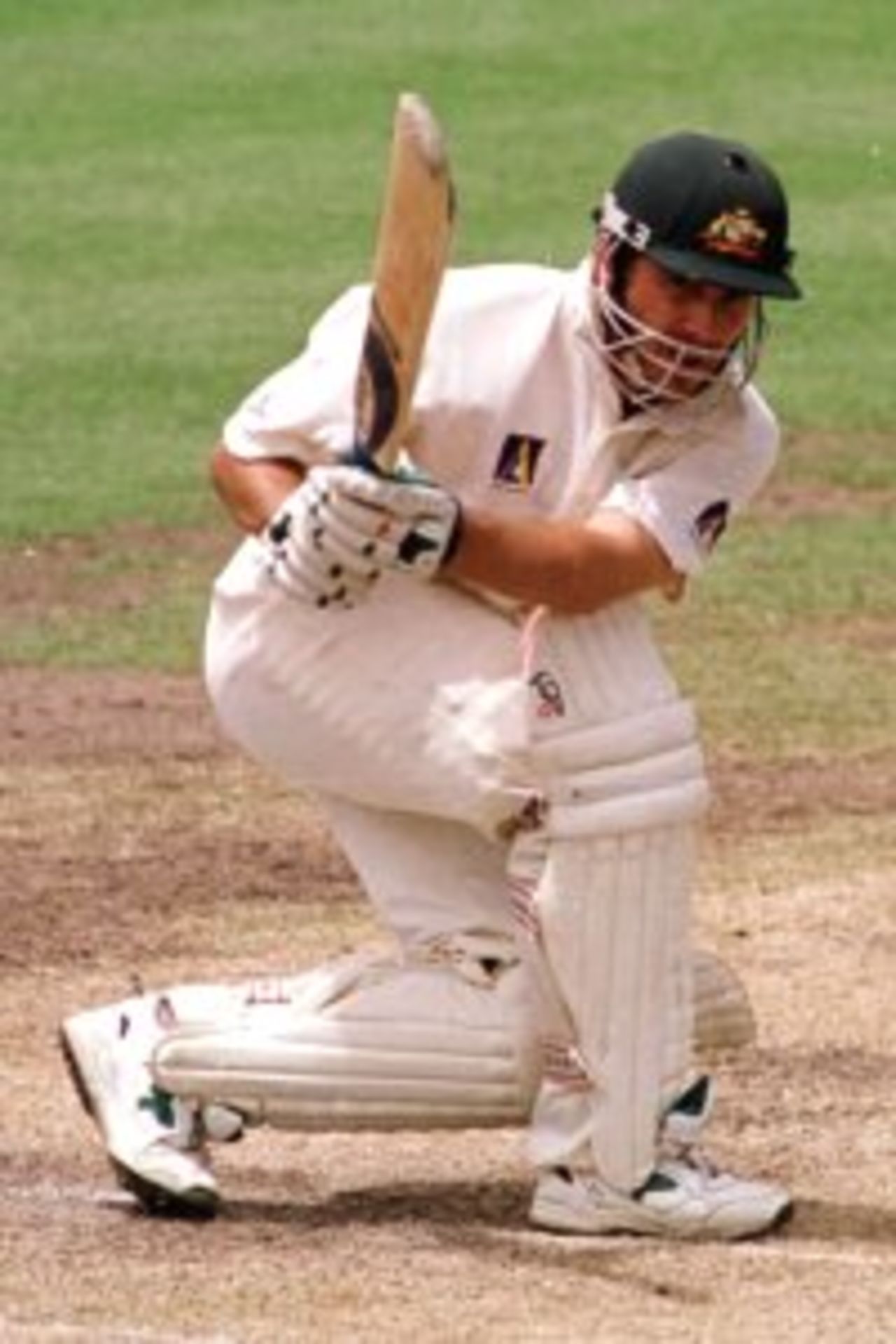 4 Jan 2000: Justin Langer of Australia sweeps behind square leg during his innings of 223 as wicketkeeper Mannava Prasad of India looks on during the third days play of the Third Test Match between Australia and India at the Sydney Cricket Ground, Sydney, Australia.