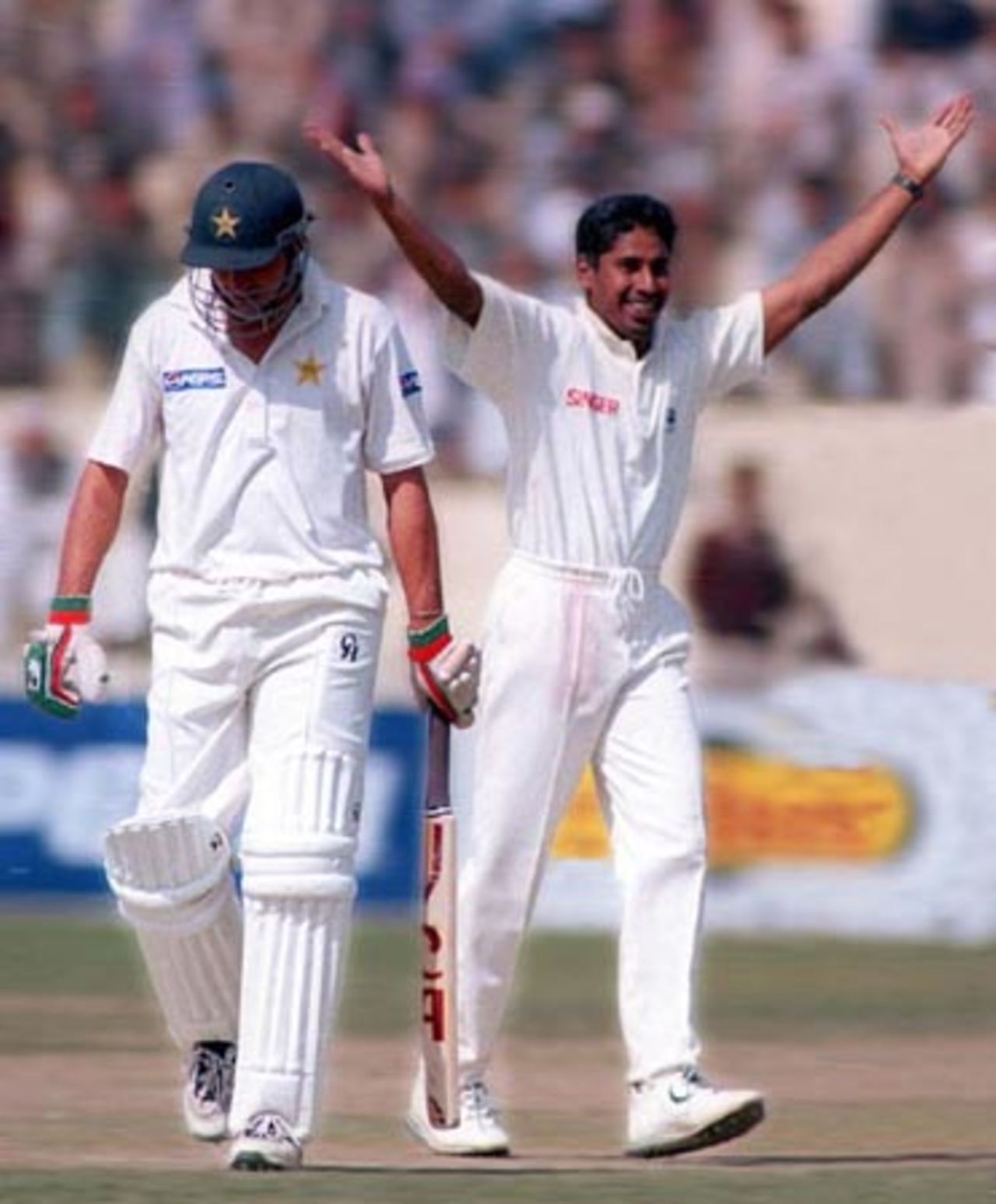 Shahid Afridi walks back to pavilion as Vaas celebrates his wicket, Pakistan v Sri Lanka, 2nd Test 12-16 March 2000
