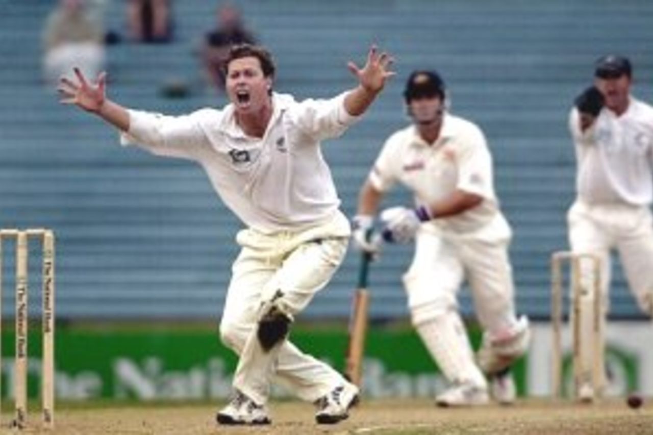 13 Mar 2000: New Zealand spinner Paul Wiseman appeals unsuccessfully for lbw against Australian batsman Adam Gilchrist during a rain delay during day 3 of the first test between Australia and New Zealand at Eden Park,Auckland, New Zealand.