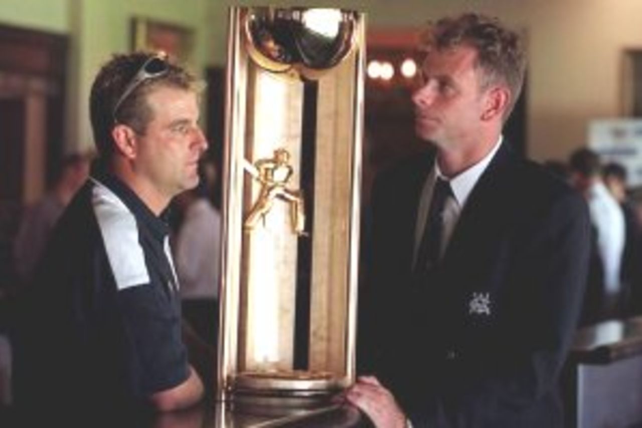 14 Mar 2000: Darren Berry and Victorian Captain Paul Reiffel stand with the Pura Milk Cup crafted by Flynn Silver in Kyneton during an unvieling of the new Cup that replaces the Sheffield Shield at the Melbourne Cricket Ground in Melbourne, Australia.