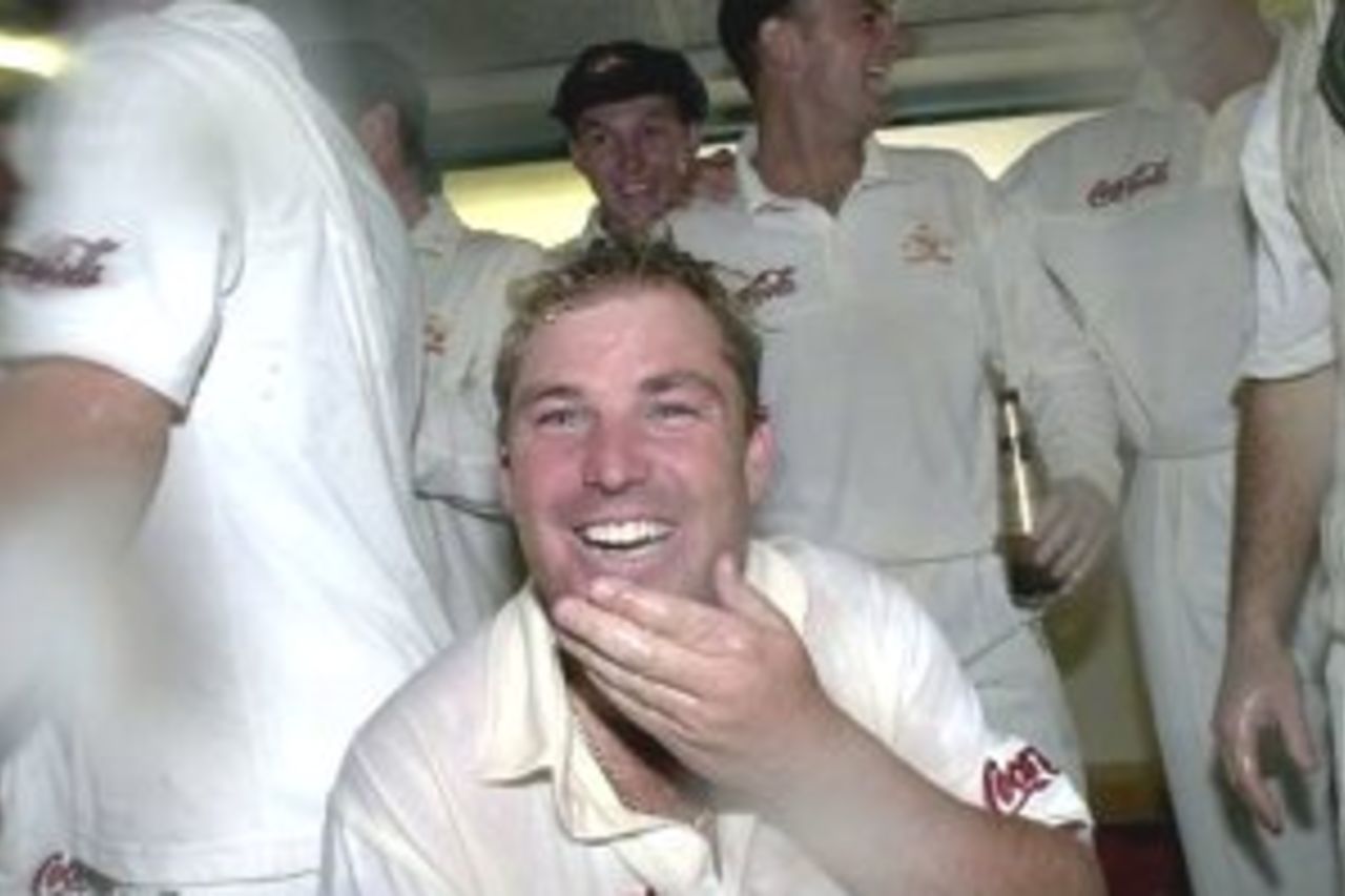 15 Mar 2000: Australian spin bowler Shane Warne is drenched in champagne by fellow Australian teammates after Warne broke Dennis Lillee's record to give him 356 Test wickets during the first test between Australia and New Zealand at Eden Park,Auckland, New Zealand. Warne's wicket of Paul Wiseman, out caught by Gilchrist, also won the match for Australia.