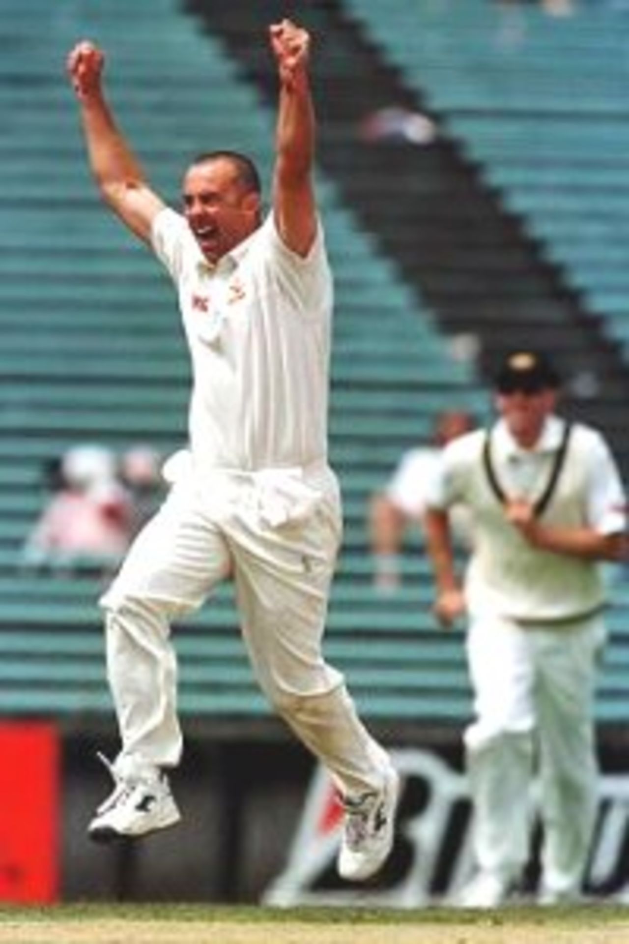 15 Mar 2000: Colin Miller of Australia celebrates after taking the wicket of Daniel Vettori for a duck, caught by Shane Warne, on day five of the first test match between New Zealand and Australia, Eden Park, Auckland, New Zealand.