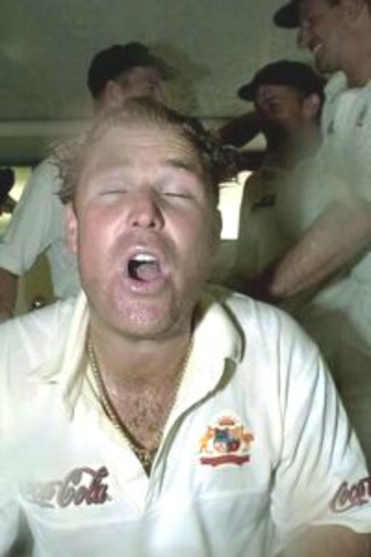 15 Mar 2000: Australian spin bowler Shane Warne is drenched in champagne by fellow Australian teammates after Warne broke Dennis Lillee's record to give him 356 Test wickets during the first test between Australia and New Zealand at Eden Park,Auckland, New Zealand. Warne's wicket of Paul Wiseman, out caught by Gilchrist, also won the match for Australia.
