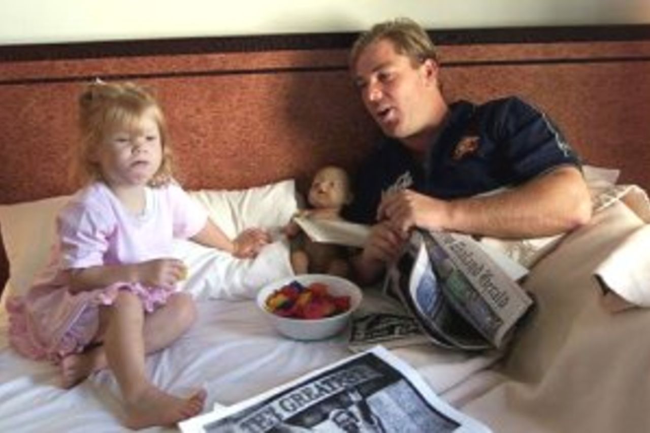 16 Mar 2000: Shane Warne of Australia relaxes in bed with daughter Brooke, the day after taking his 356th test wicket to surpass Dennis Lillee as Australia'a greatest test wicket taker, Heritage Hotel, Auckland, New Zealand.