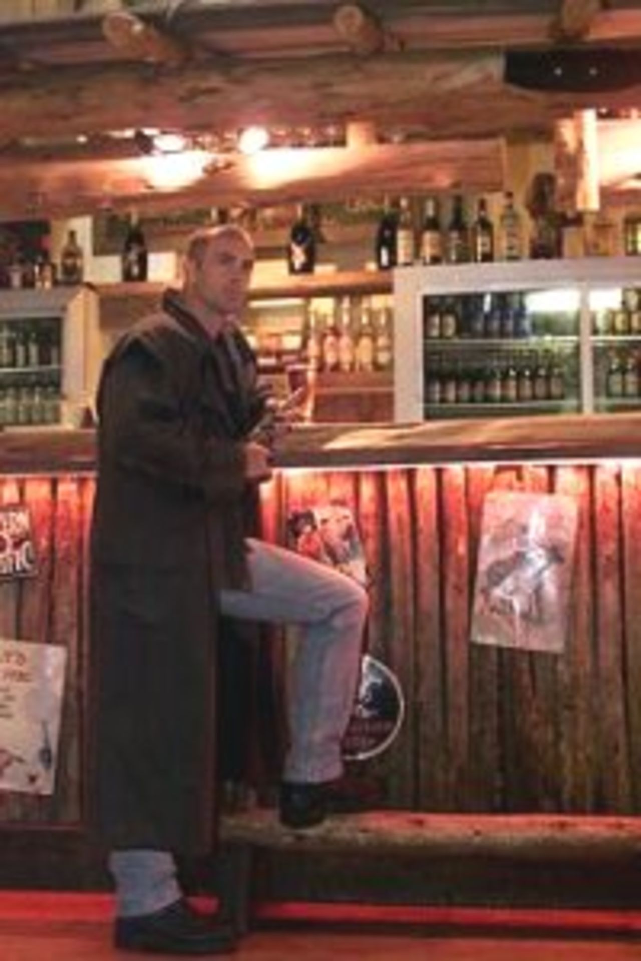 17 Mar 2000: Colin Miller of Australia relaxes at the bar in the Grumpy Mole Saloon, Napier, New Zealand.