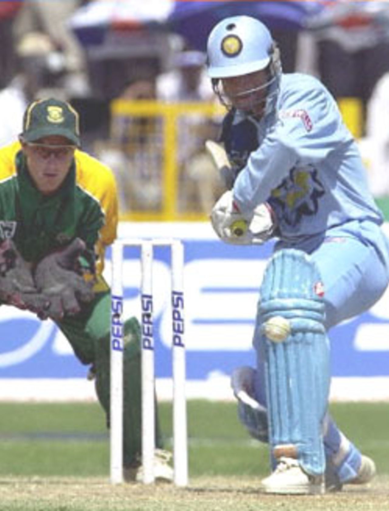 Indian batsman Rahul Dravid on his way to 73 runs during the one-day cricket international between India and South Africa 15 March 2000. South Africa are chasing India's challenging 248. With the gloves at ready is South African wicket keeper  Mark Boucher (L).