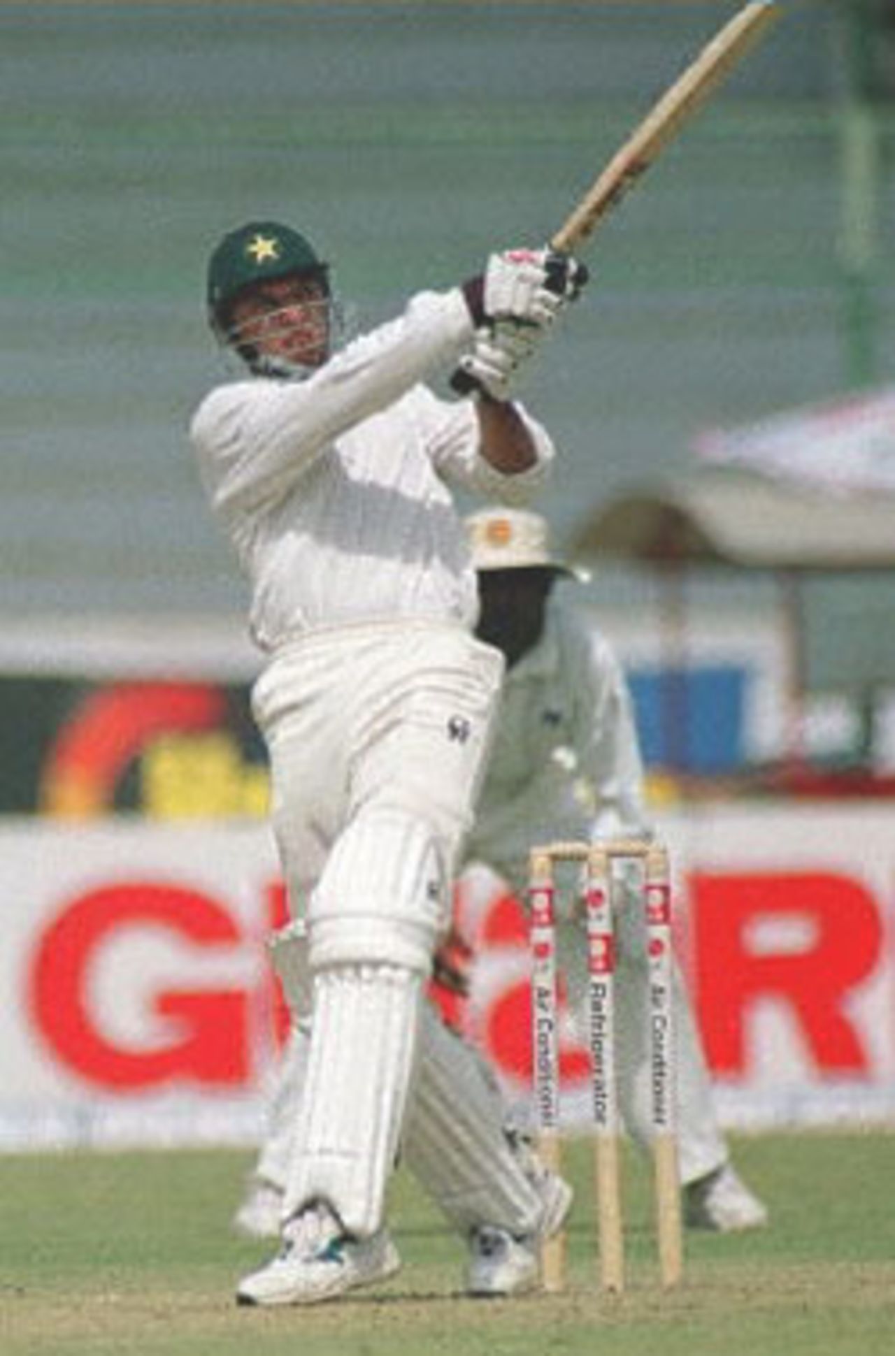 Pakistan opening batsman Shahid Afridi pulls a boundarv off Sri Lankan pacer Chaminda Vaas on the first day of the third and final cricket Test in Karachi, 12 March 2000. Pakistan were 164 runs for 6 wickets with Afridi making 74 runs.