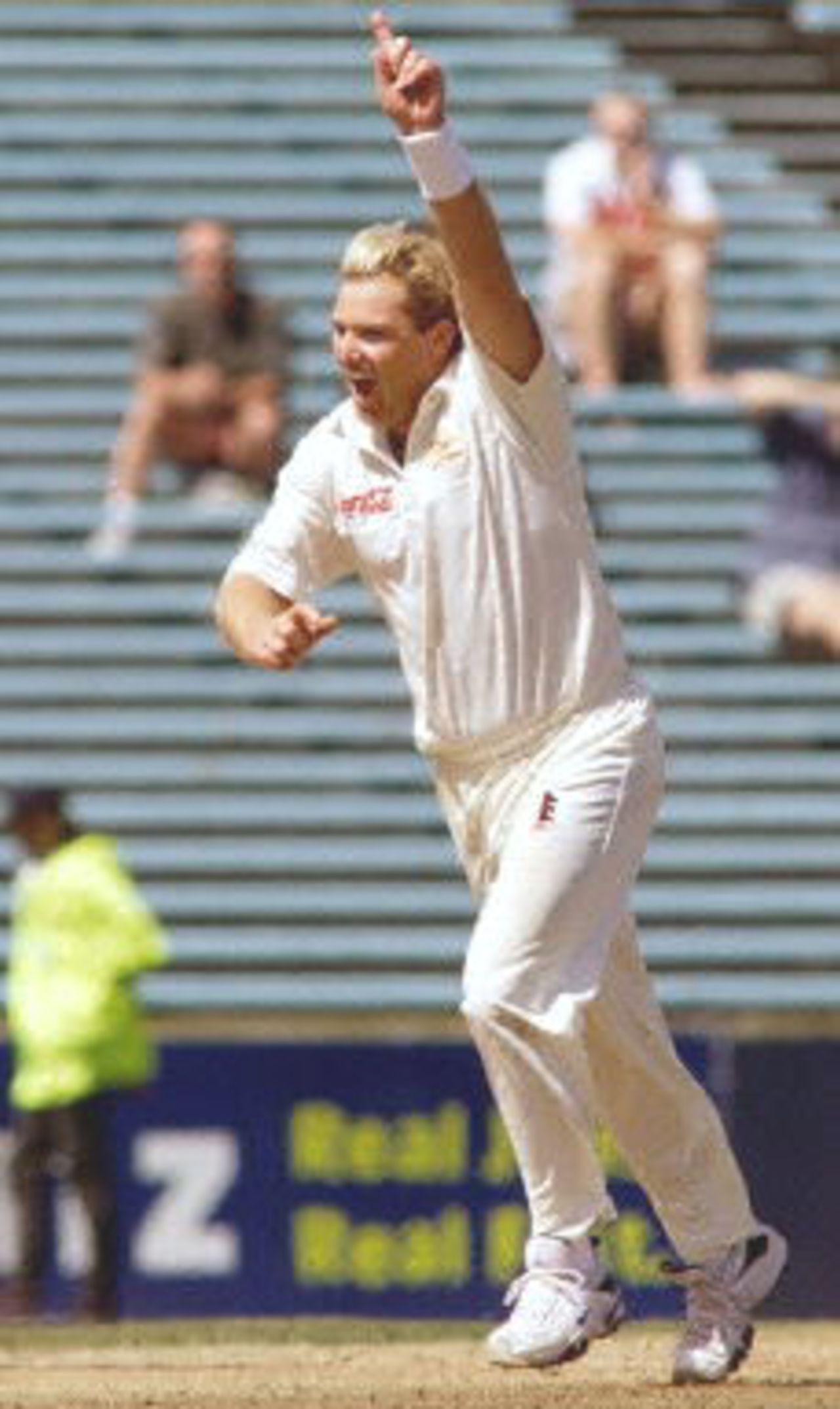 Australia spinner Shane Warne celebrates after taking the wicket of New Zealand batsman Paul Wiseman, the 356th of his career, to break the Australian Test wicket-taking record of 355 held by former paceman Dennis Lille, on the last day of the first Test match between Australia and New Zealand at Eden Park in Auckland 15 March 2000. Australia defeated New Zealand by 62 runs and in doing so also equalled the Australian record for consecutive Test victories at eight.
