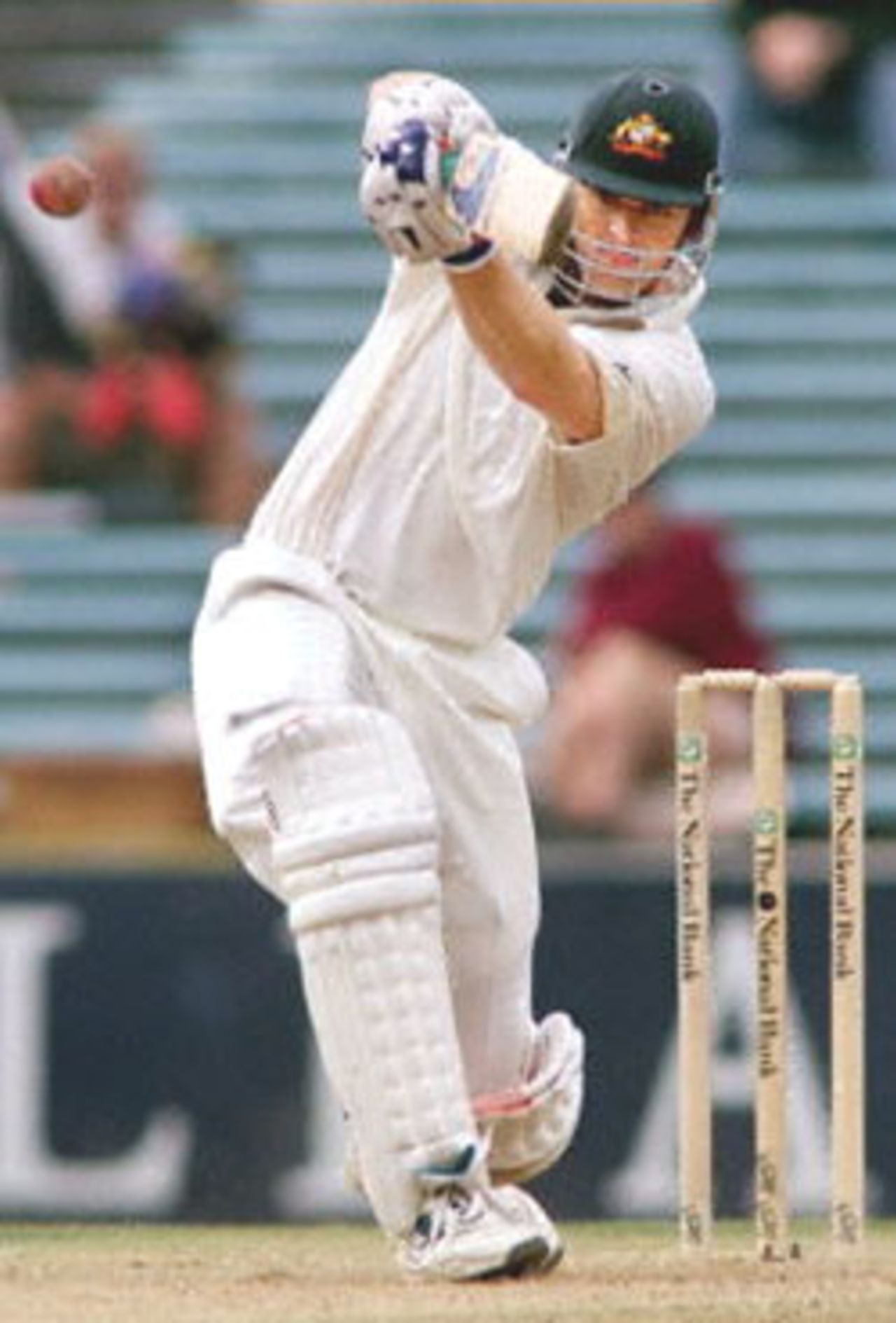 Australian batsman Adam Gilchrist lofts a ball to the boundary from New Zealand bowler Paul Wiseman on the third day of the first Test match played at Eden Park in Auckland 13 March 2000. Gilchrist was 51 not out and Australia in their second innings were 206-7 for a lead of 257 run at lunch.