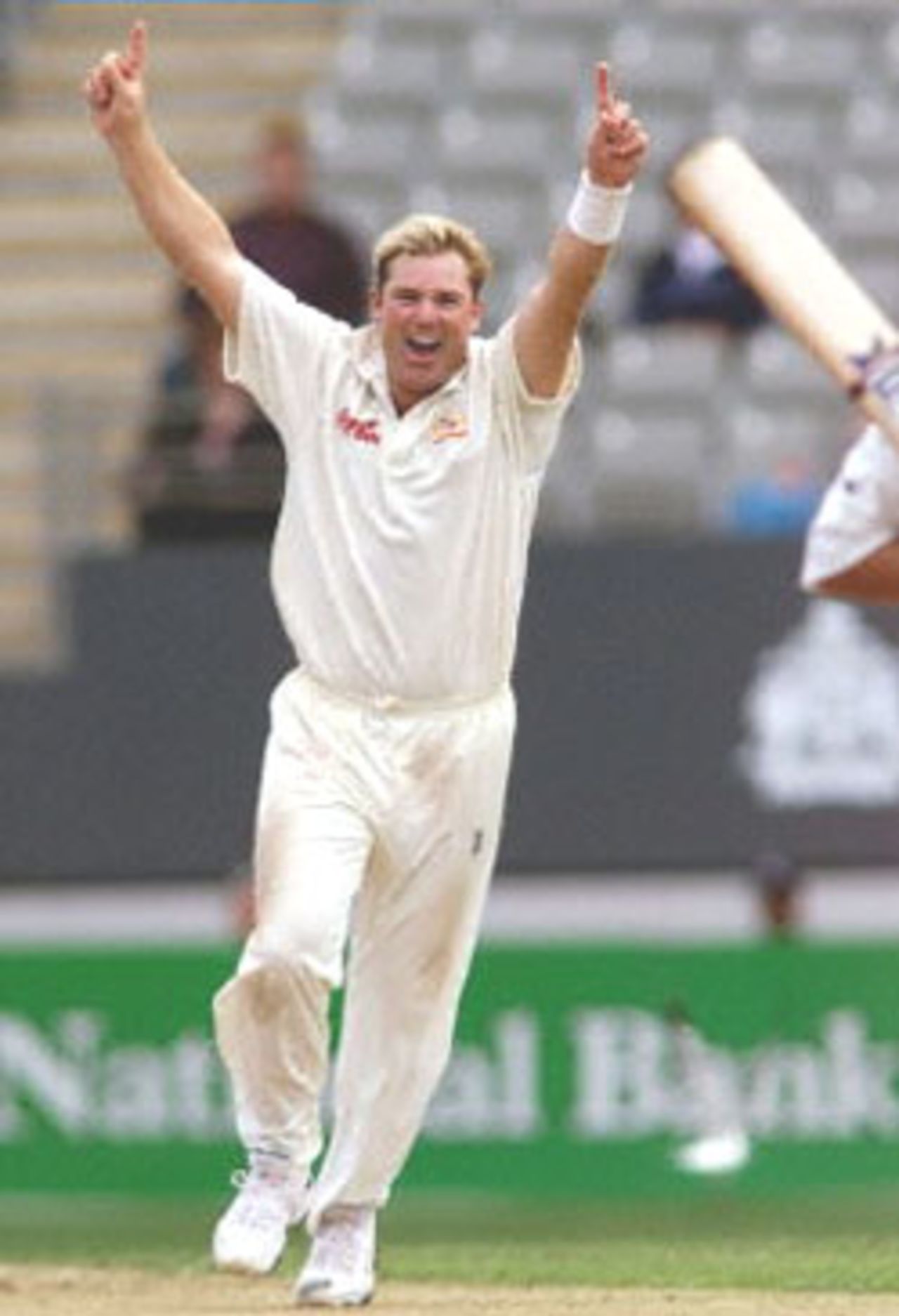 Australian spinner Shane Warne celebrates capturing the wicket of New Zealand batsman Craig McMillan as Warne closes in on the Australian Test wicket taking record held by Dennis Lillee, on the second day of the first Test match being played at Eden Park in Auckland 12 March 2000. Australia was dismissed for 214 in their first innings and in reply New Zealand is 110-7 at lunch.