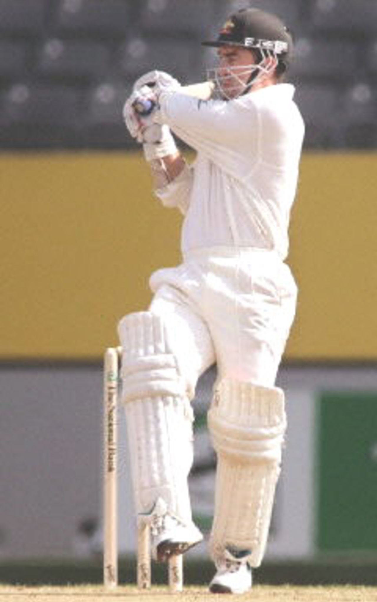 Australian batsman Justin Langer hooks a ball on the way to an innings of 46 runs against New Zealand on the first day of the first Test match being played at Eden Park in Auckland, 11 March 2000. Australia was dismissed for 214 in their first innings and in reply New Zealand is in trouble at 26-4 at stumps.