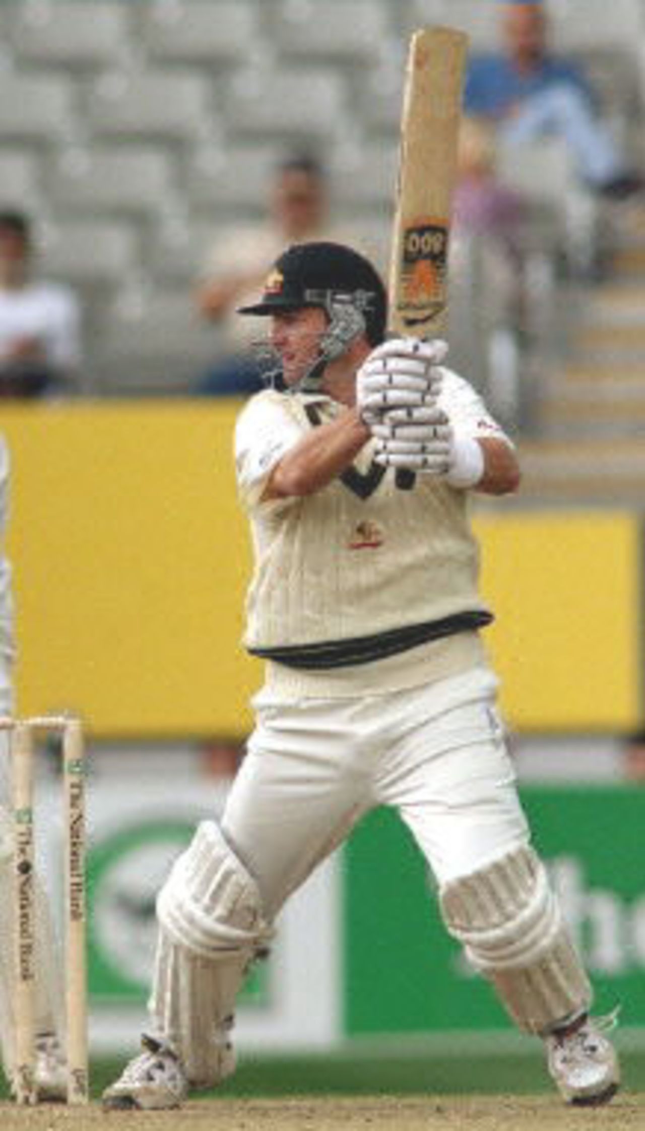 Australian batsman Mark Waugh cuts a ball through point on the way to topscoring for Australia against New Zealand on the first day of the first Test match being played at Eden Park in Auckland, 11 March 2000. Australia was dismissed for 214 in their first innings and in reply New Zealand is in trouble at 26-4 at stumps.