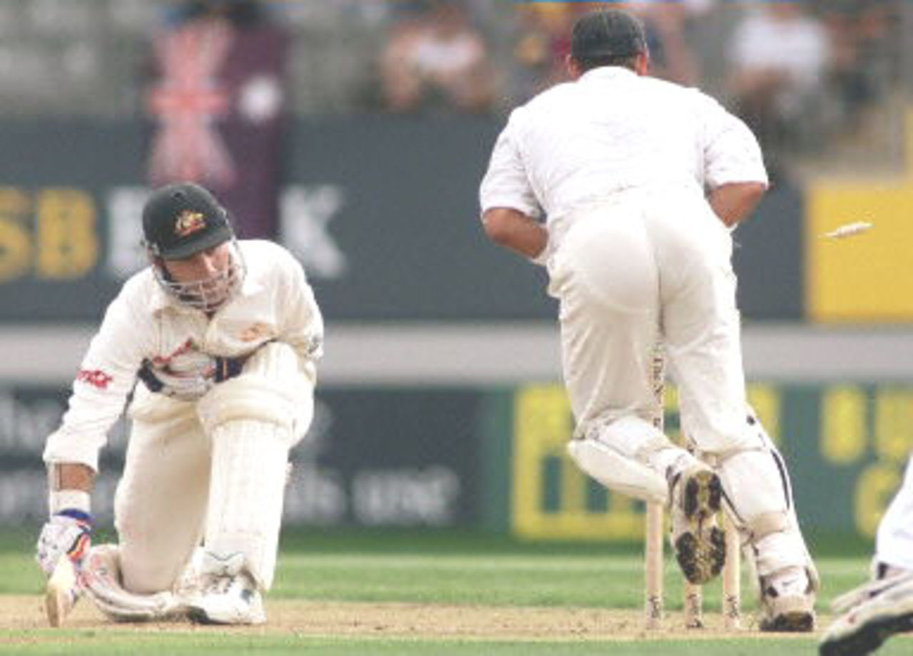 Australian batsman Justin Langer (L) is stumped for 46 by New Zealand wicketkeeper Adam Parore (R) of the bowling of Paul Wiseman on the first day of the first Test Match at Eden Park in Auckland 11 March 2000. At lunch Australia is 97-3 with Mark and Steve Waugh the not out batsmen.
