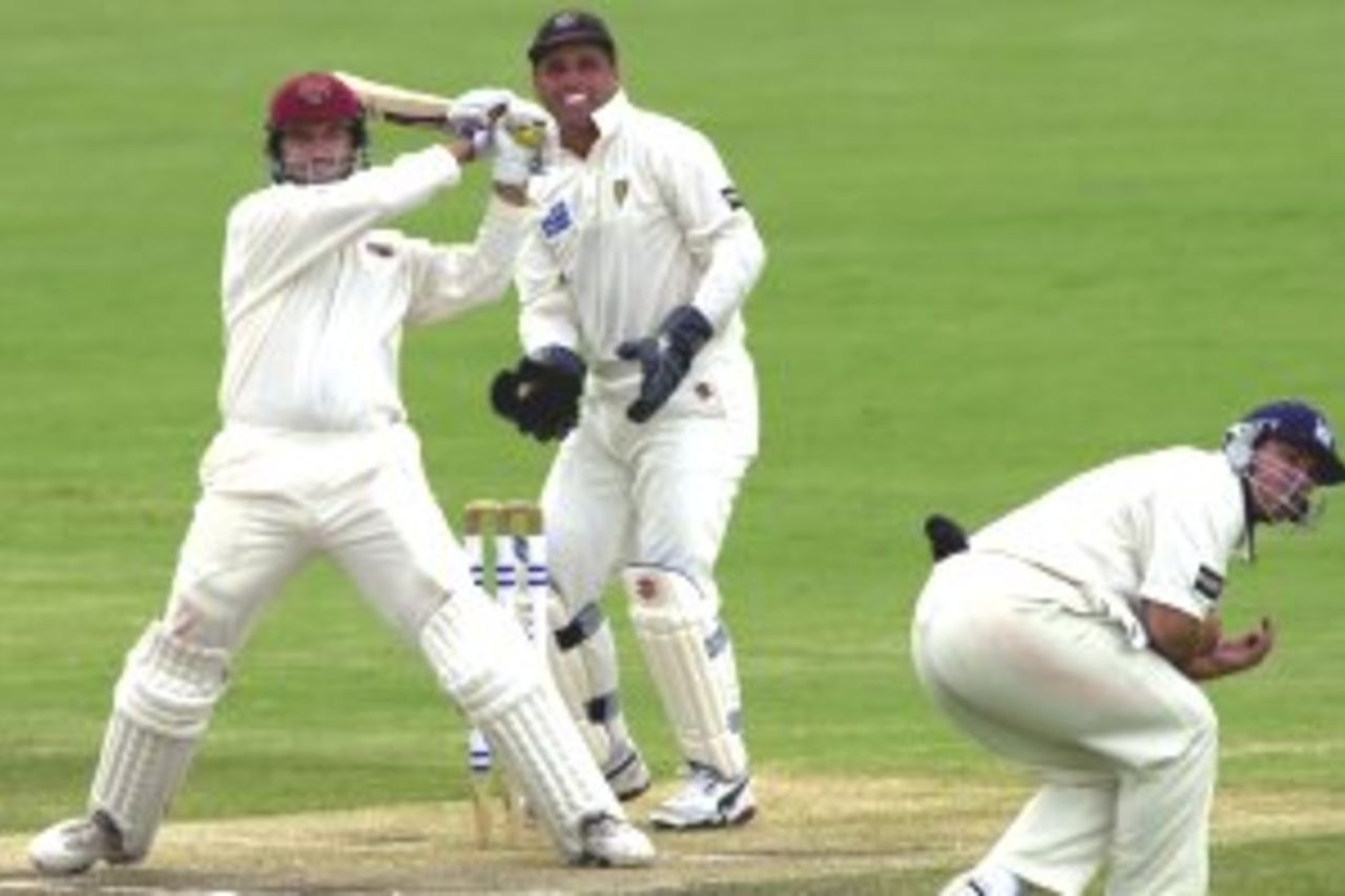 20 Mar 2000: Stuart Law of Queensland hits a four past Jason Arnberger of Victoria during the Pura Milk Cup final played at Allan Border Field in Brisbane, Australia.