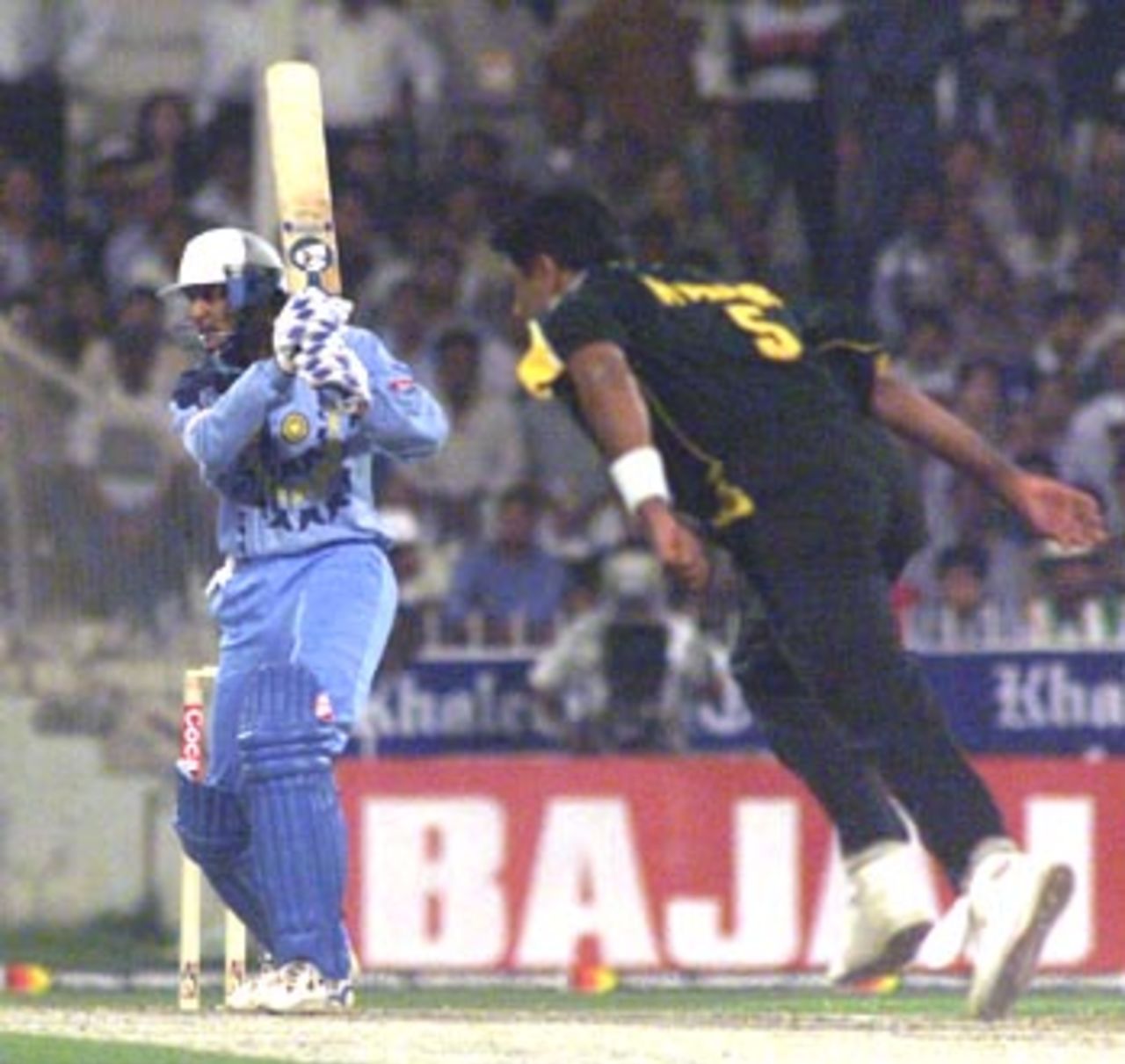 Azhar plays a wristy square drive of Waqar Younis, India v Pakistan, Coca-Cola Cup, 1999/00, Sharjah C.A. Stadium, 23 March 2000